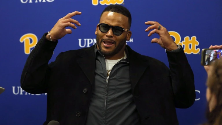 Speculation swirls as Aaron Donald donns helmet at Rams facility