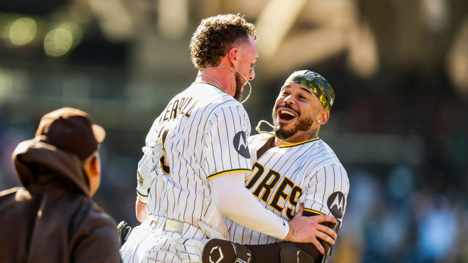 Padres rally in extras to sweep Brewers and hold onto playoff spot