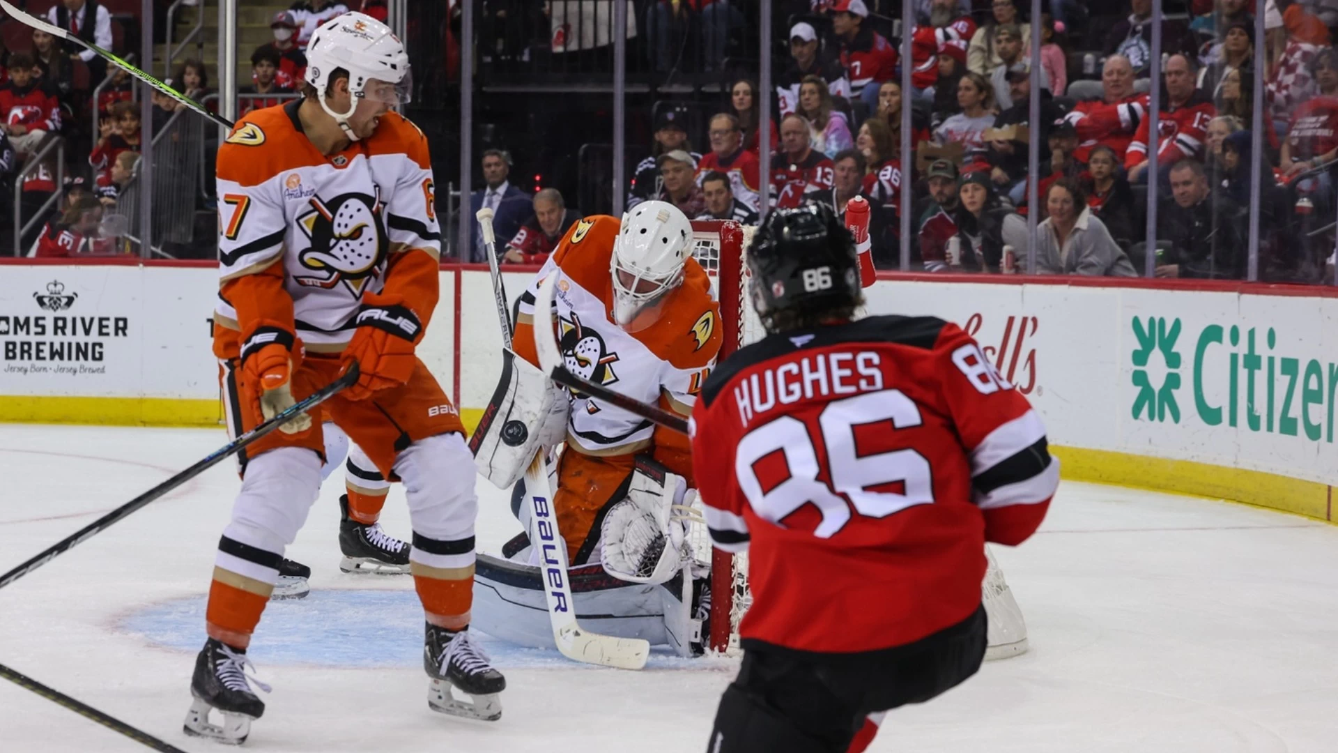 Hughes Brothers Face Off in Exciting Canucks-Devils Game