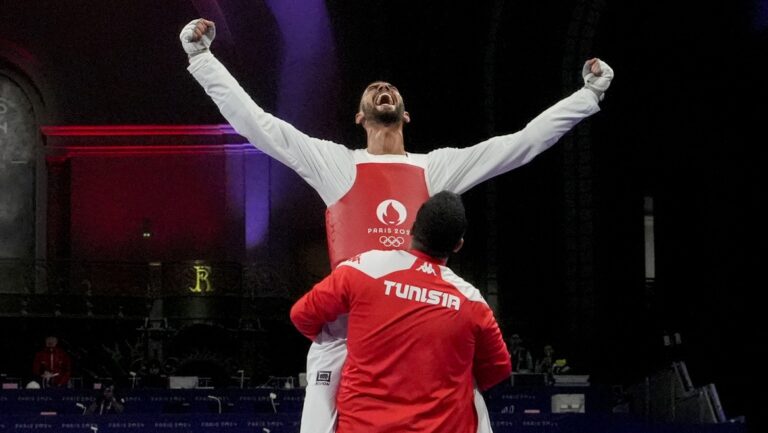 52) (tied) Tunisia: 1 Gold Medal (1 Silver Medal+1 Bronze Medal)