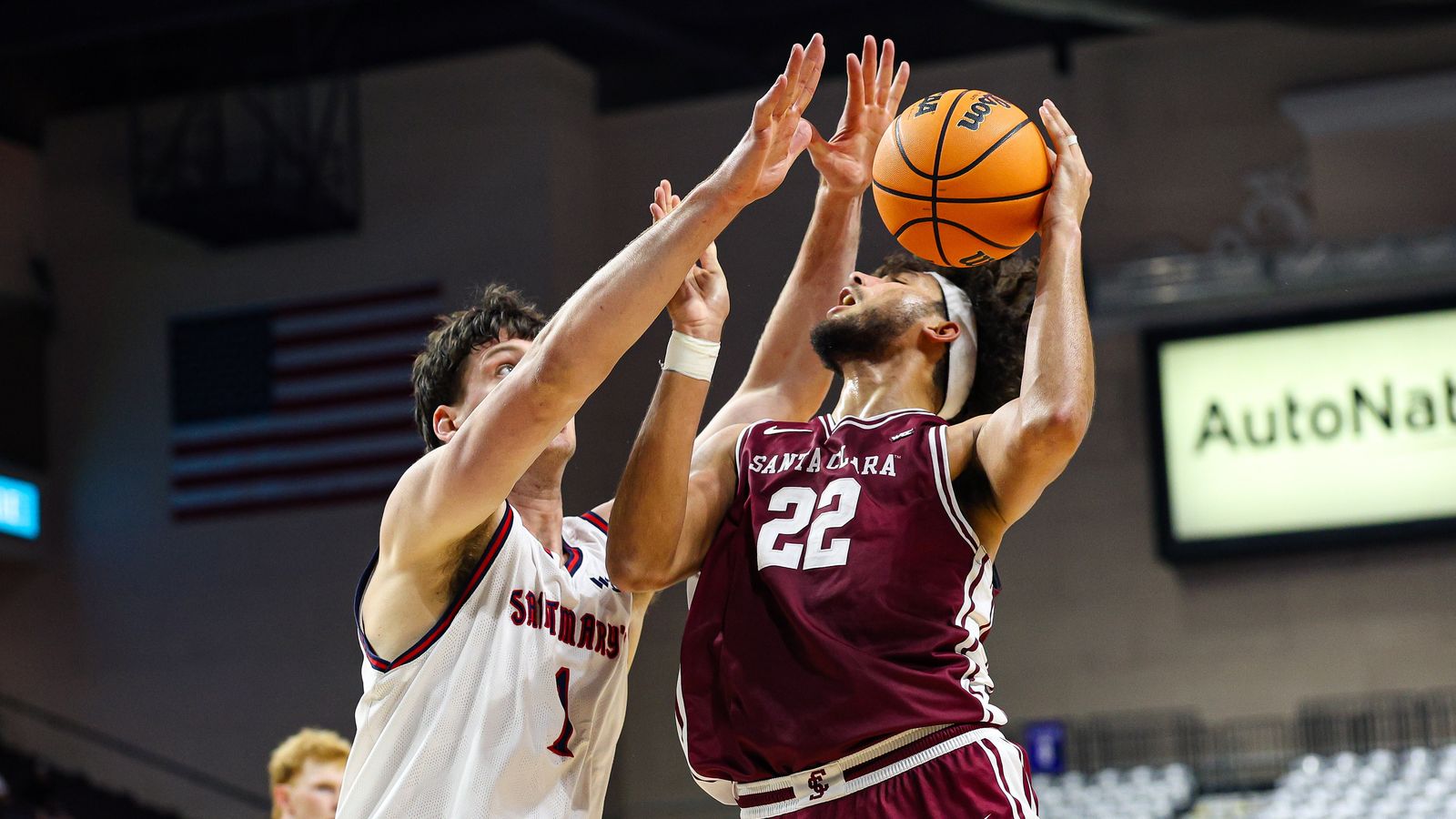 Santa Clara Broncos F Allen Graves (22) shoots a basket while being fouled by Saint Mary's Gaels C Harry Wessels (1) at the 2026 WCC Tournament Semi-Finals on Monday March 9, 2026, in Las Vegas, Nevada.