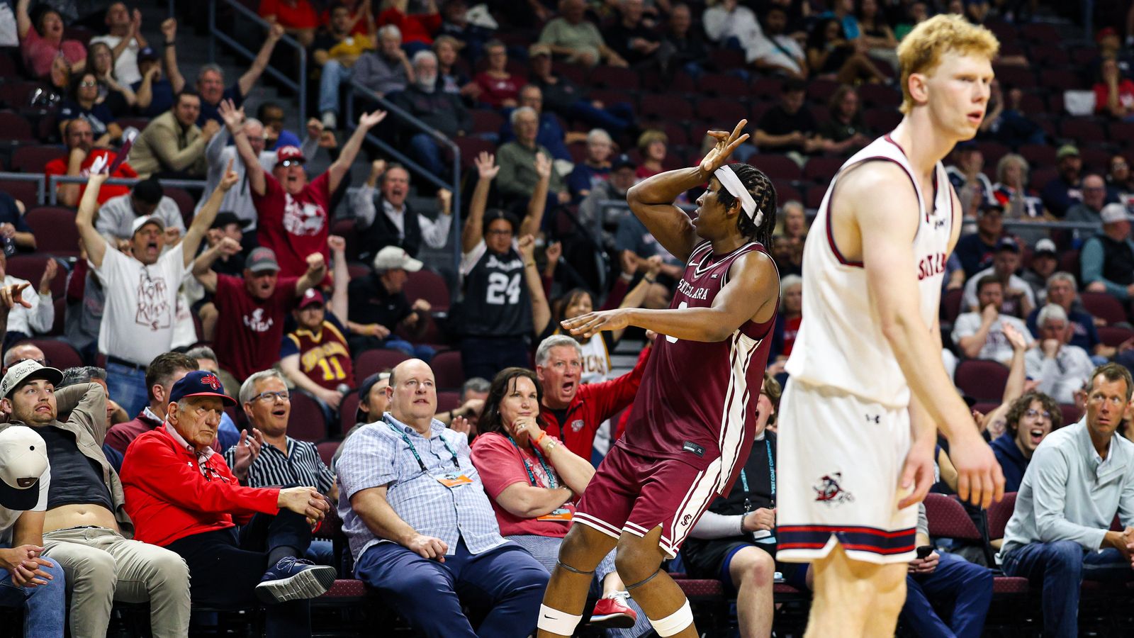 Santa Clara Broncos F Elijah Mahi (8) reacts with the crowd after he drained a late three-point shot against the Saint Mary's Gaels on Monday March 9, 2026, in Las Vegas, Nevada.