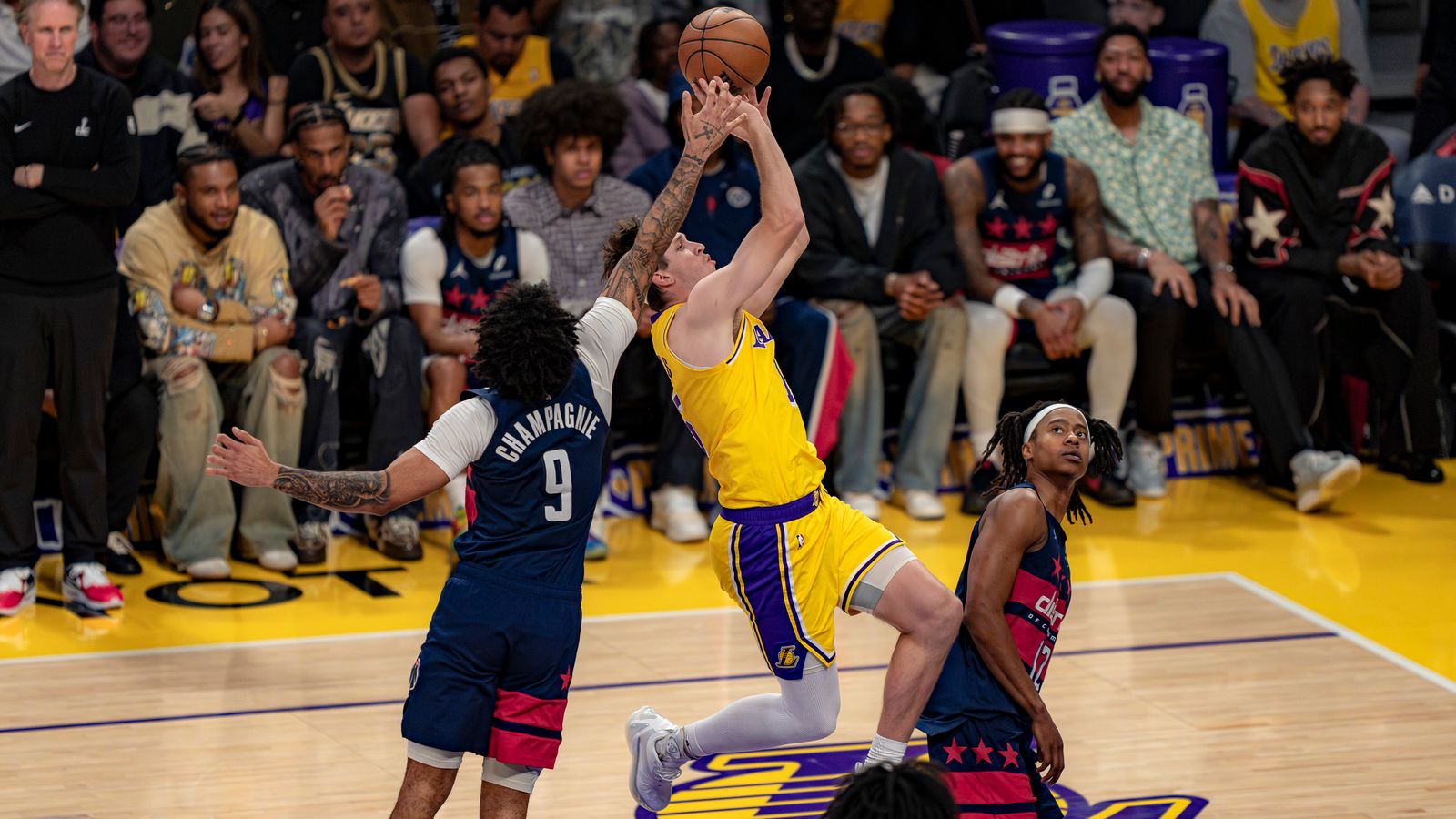 Austin Reaves Battles Through a Foul in the Paint