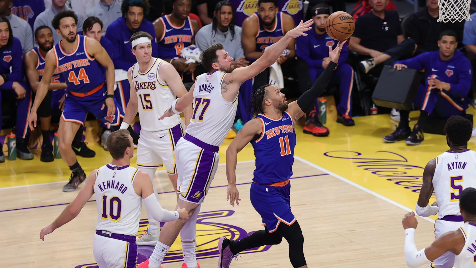Los Angeles Lakers guard Luka Doncic (77) defends against New York Knicks guard Jalen Brunson (11) during an NBA game on March 8, 2026 in Los Angeles, CA.