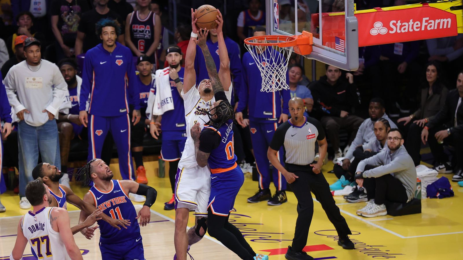 Los Angeles Lakers center Jaxson Hayes (11) catches a lob pass during an NBA game against the New York Knicks on March 8, 2026 in Los Angeles, CA.