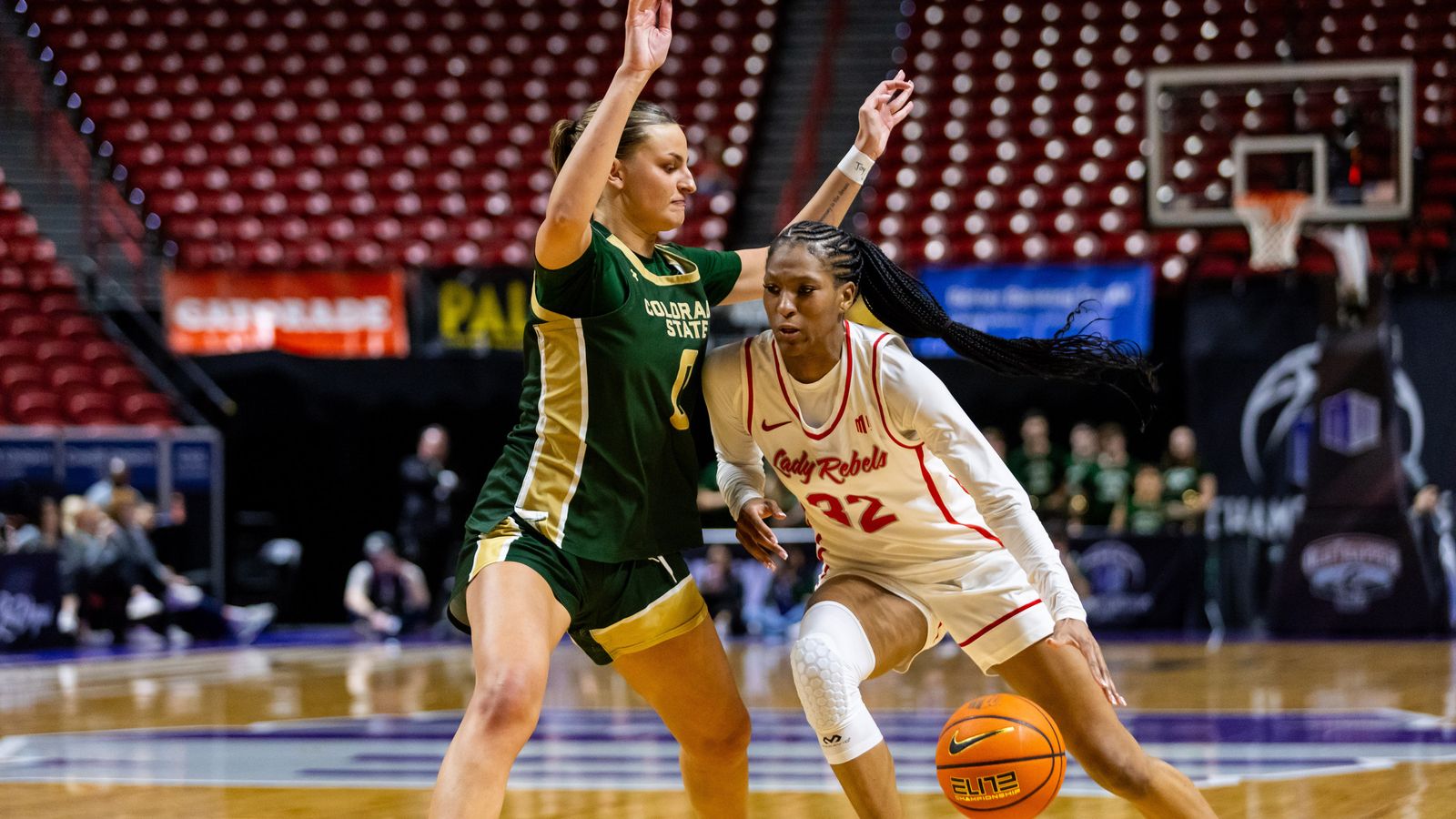 UNLV Lady Rebels forward Meadow Rowland (32) dribbles the ball towards the basket during a Mountain West Tournament semifinal game between UNLV Lady Rebels and the Colorado State Rams, Monday March 9, 2026 in Las Vegas, Nev.