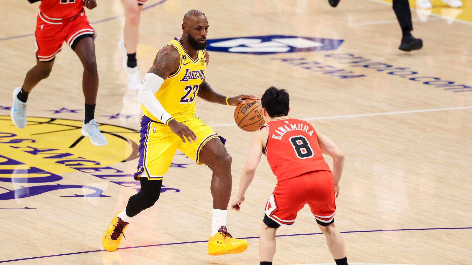 LeBron James #23 of the Los Angeles Lakers drives towards the rim as Yuki Kawamura #8 of the Chicago Bulls steps in front to defend during an NBA basketball game, Thursday March 12, 2026 in Los Angeles, Calif.