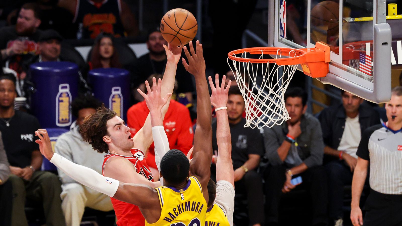 Josh Giddey #3 of the Chicago Bulls lays the bal up over Rui Hachimura #28 of the Los Angeles Lakers during an NBA basketball game, Thursday March 12, 2026 in Los Angeles, Calif.