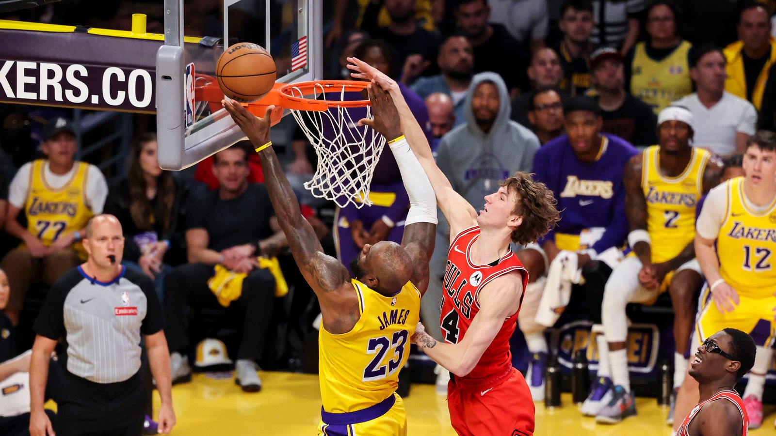LeBron James #23 of the Los Angeles Lakers lays the ball up past Matas Buzelis #14 of the Chicago Bulls during an NBA basketball game, Thursday March 12, 2026 in Los Angeles, Calif.