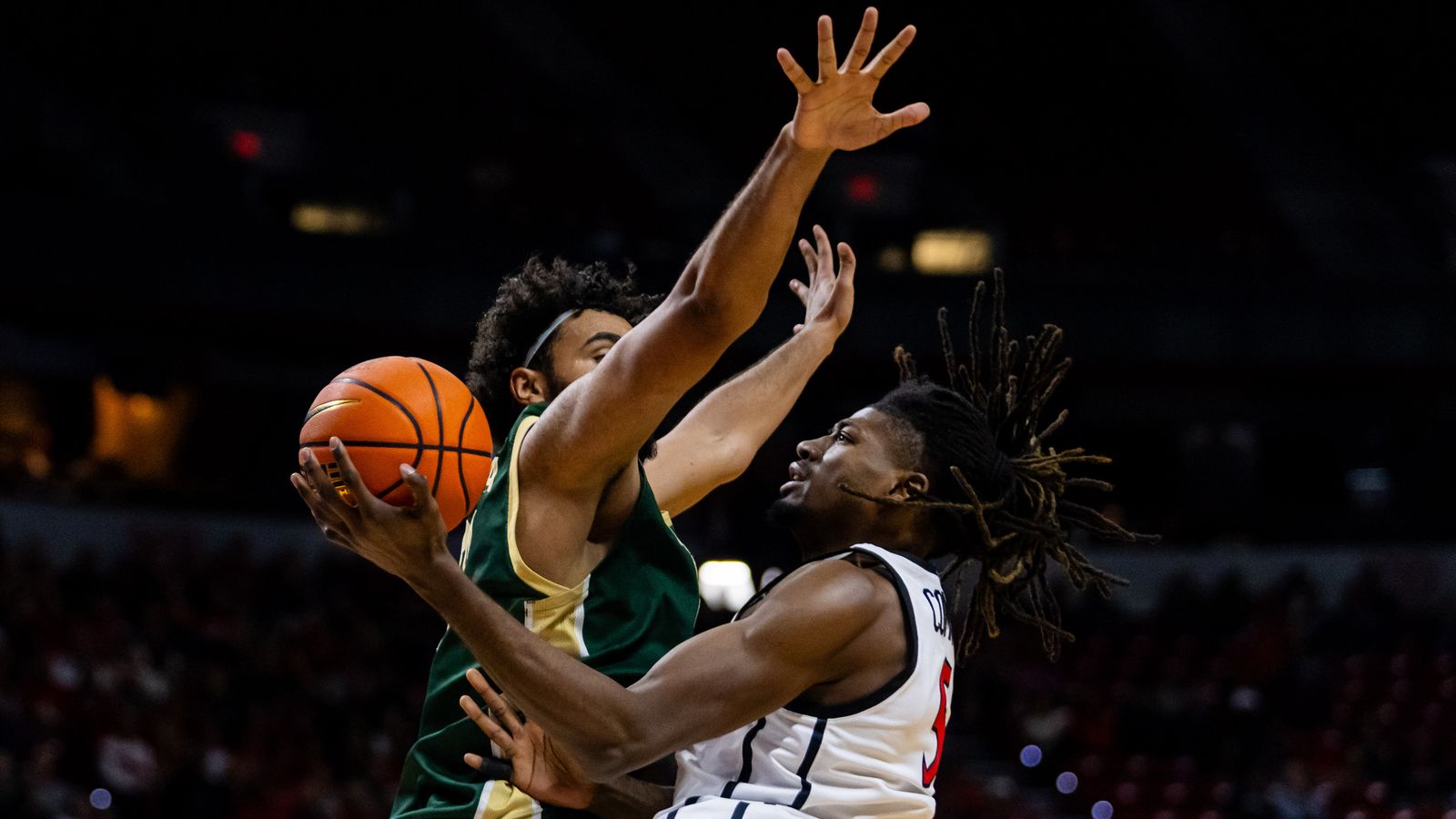 San Diego Aztecs forward Pharaoh Compton (5) goes for a contested lay-up during a Mountain West Championship tournament quarterfinal game between the San Diego Aztecs and the Colorado State Rams, Thursday March 12, 2026 in Las Vegas, Nev.