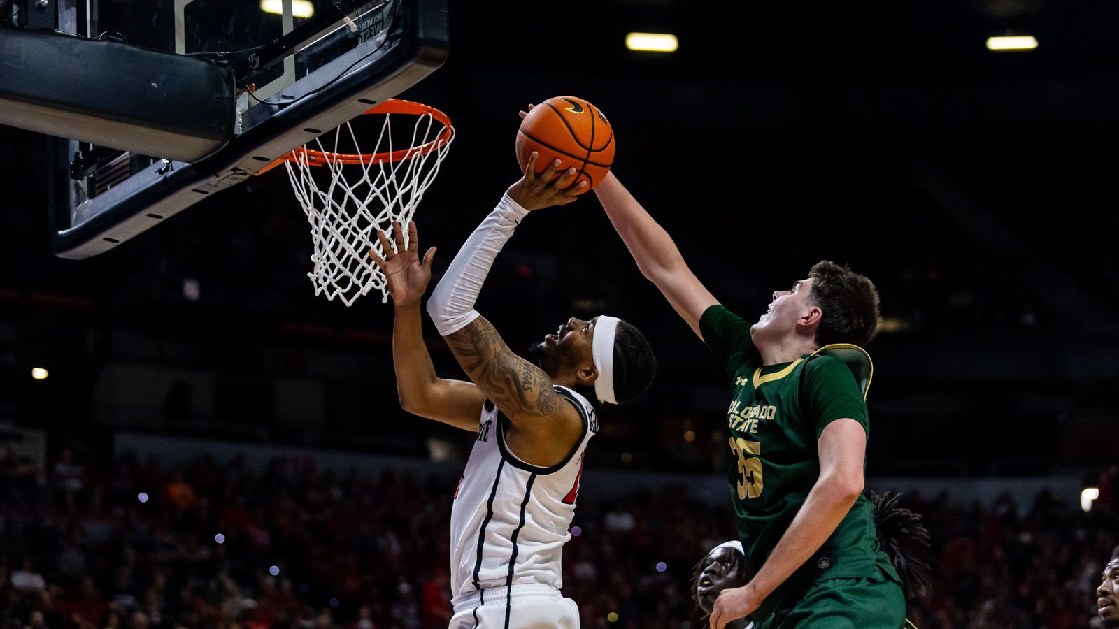 San Diego Aztecs guard Taj DeGourville (24) shot is blocked by Colorado State Rams forward Kyle Jorgensen (35) during a Mountain West Championship tournament quarterfinal game between the San Diego Aztecs and the Colorado State Rams, Thursday March 12, 2026 in Las Vegas, Nev.