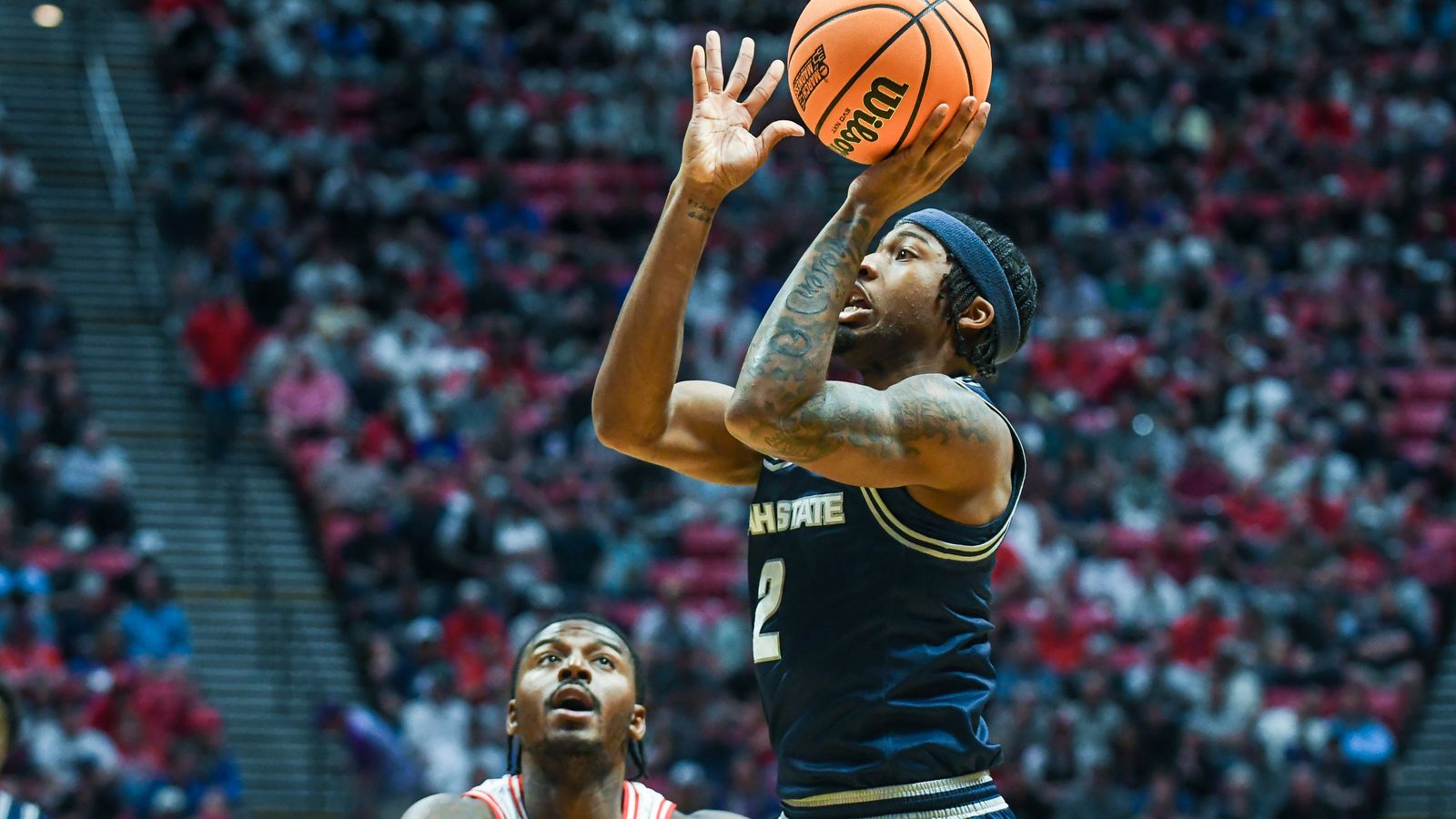 Utah State guard MJ Collins Jr. (2) shoots the ball  during an NCAA East Region second round game against  Arizona Sunday March 22, 2026 in  San Diego, California.