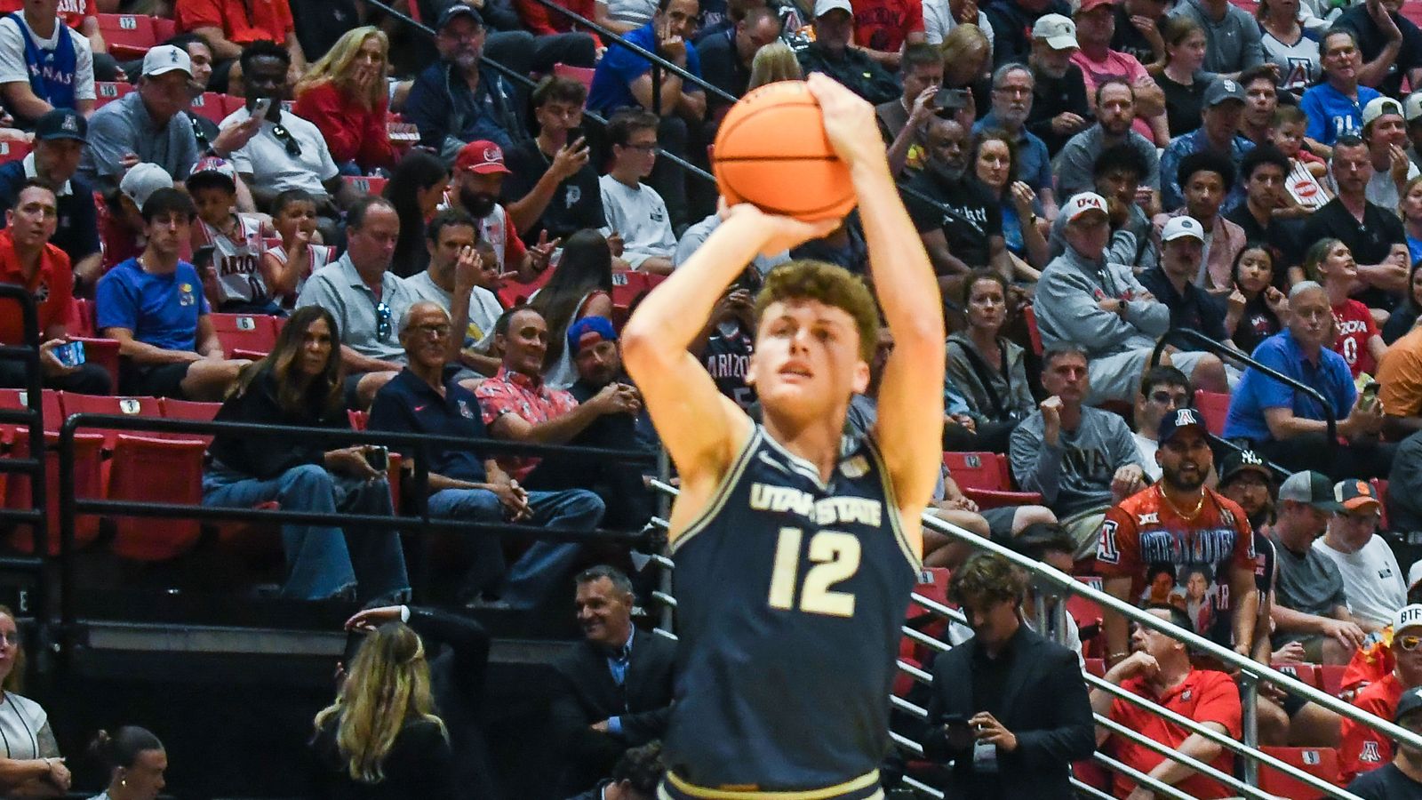Utah State guard Mason Falslev (12) shoots the ball  during an NCAA East Region second round game against  Arizona Sunday March 22, 2026 in  San Diego, California.