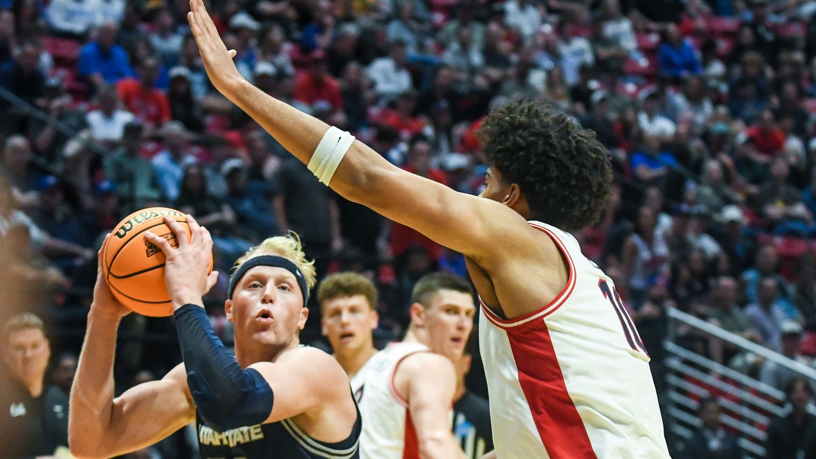 Utah State forward Karson Templin (22) looks to shoot during an NCAA East Region second round game against  Arizona Sunday March 22, 2026 in  San Diego, California.