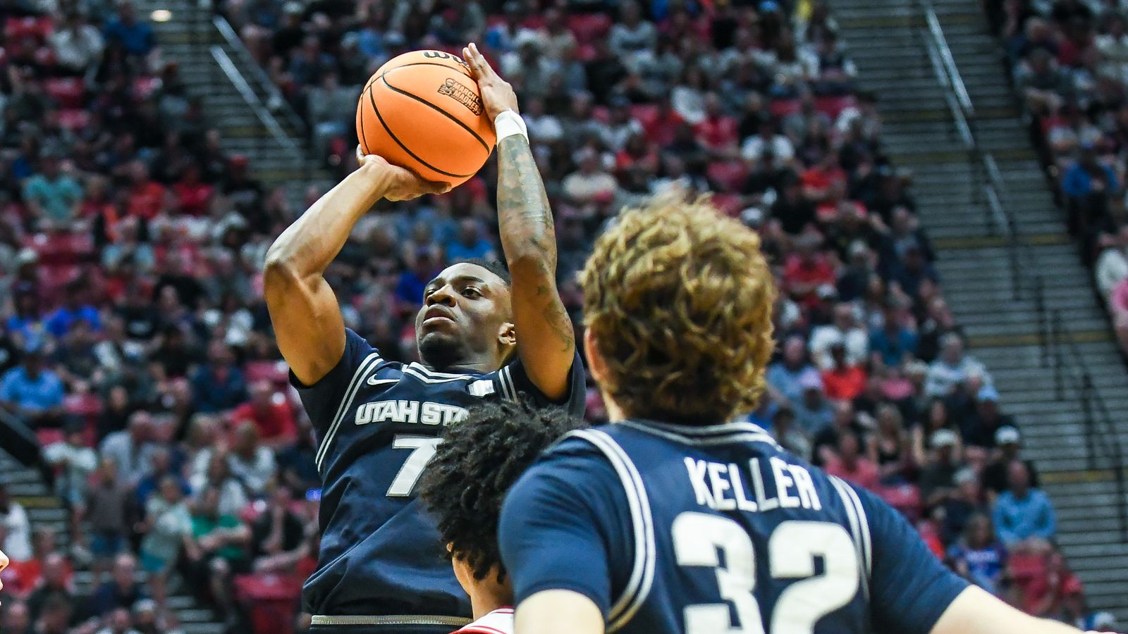 Utah State guard Kolby King (7) shoots the ball  during an NCAA East Region second round game against  Arizona Sunday March 22, 2026 in  San Diego, California.