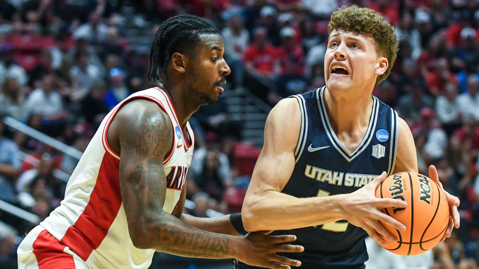 Utah State guard Mason Falslev (12) looks to shoot during an NCAA East Region second round game against  Arizona Sunday March 22, 2026 in  San Diego, California.