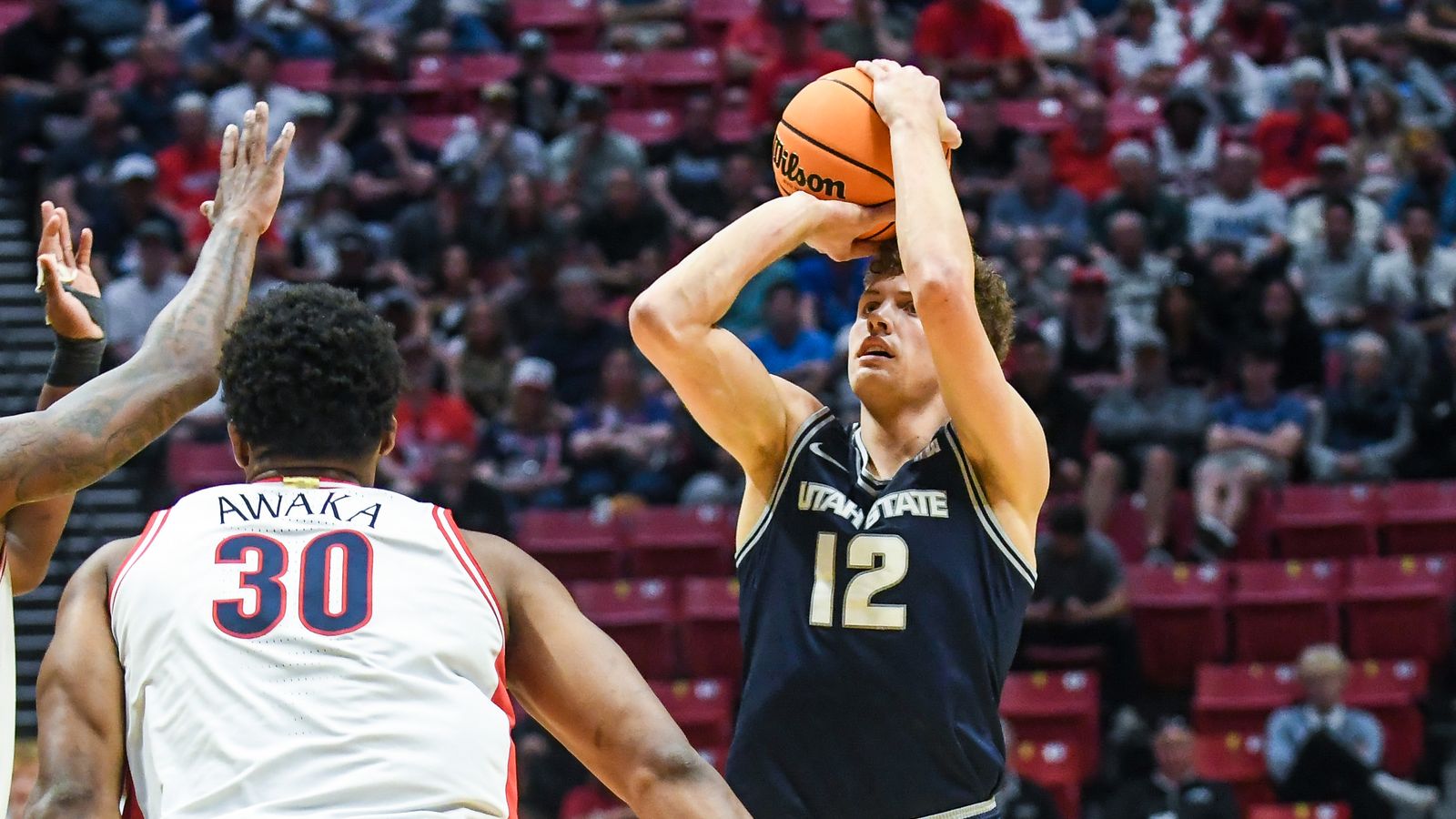 Utah State guard Mason Falslev (12) shoots the ball  during an NCAA East Region second round game against  Arizona Sunday March 22, 2026 in  San Diego, California.