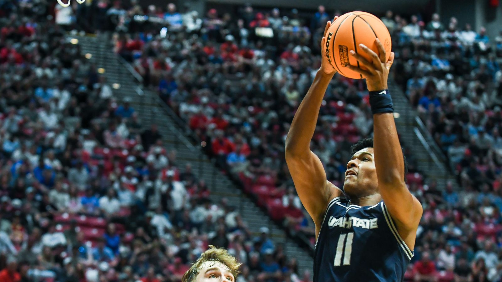 Utah State forward Garry Clark (11) catches a pass during an NCAA East Region second round game against  Arizona Sunday March 22, 2026 in  San Diego, California.