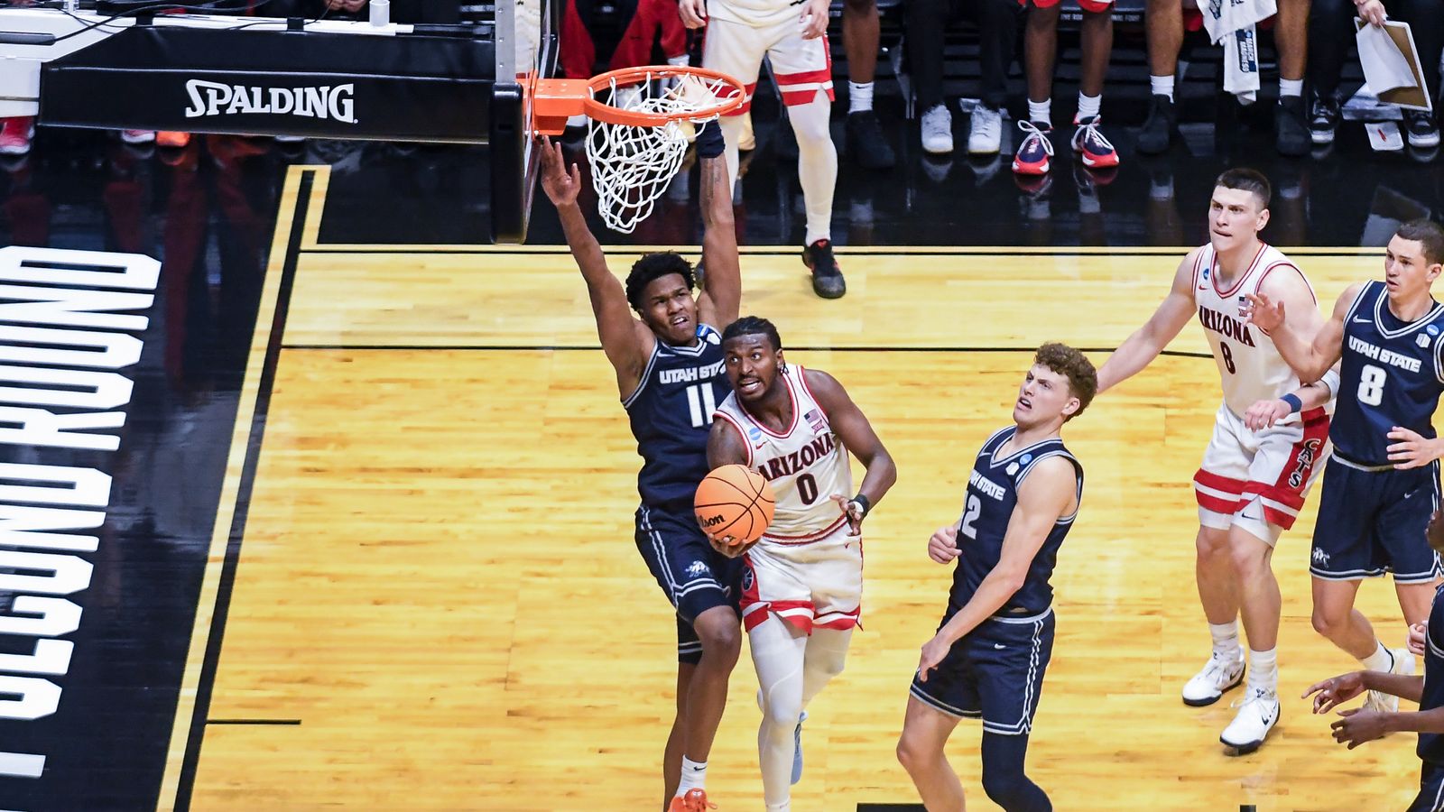 Arizona guard Jaden Bradley (0) makes a running layup during an NCAA East Region second round game against  Utah State Sunday March 22, 2026 in  San Diego, California.