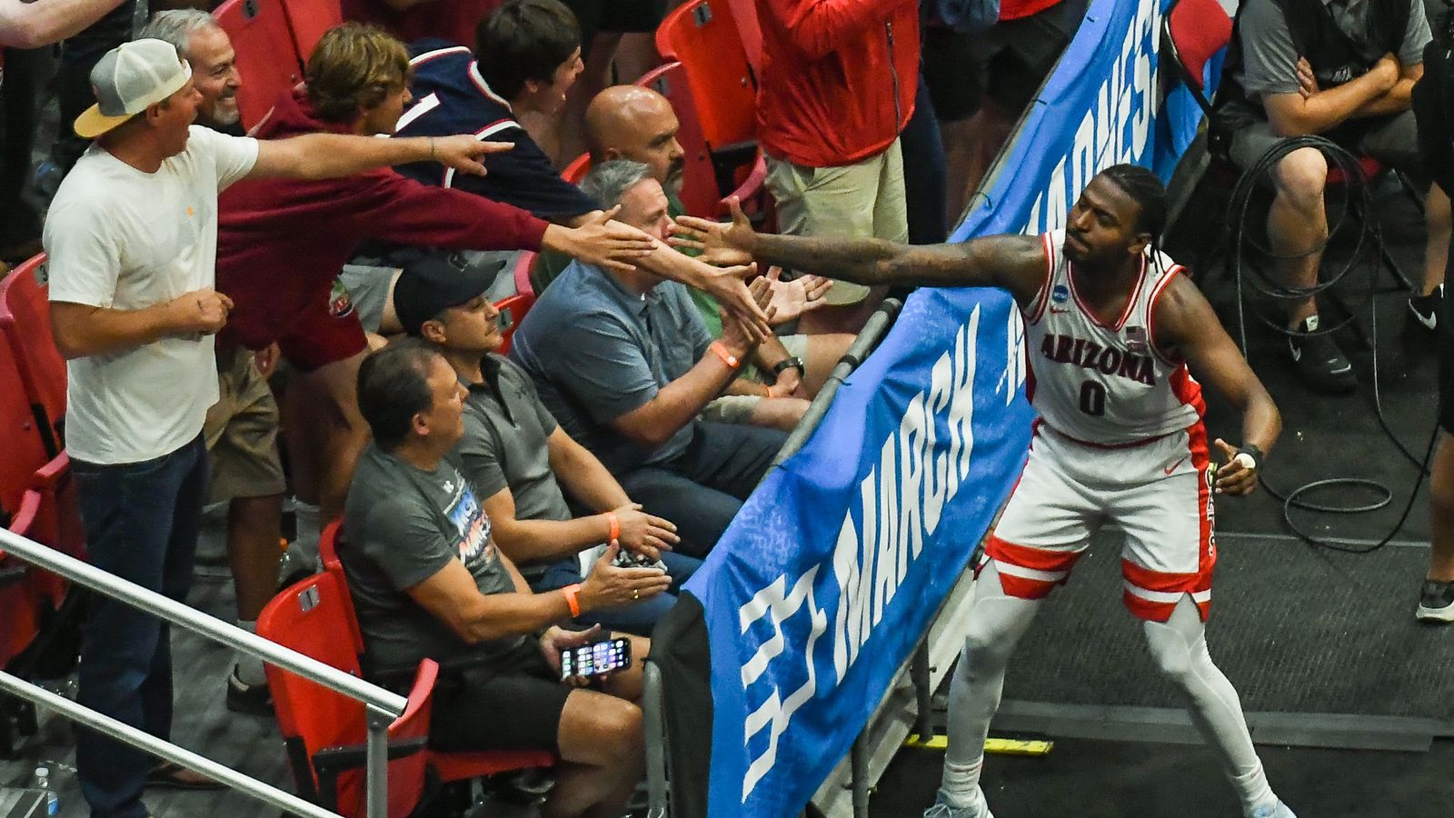 Arizona guard Jaden Bradley (0) celebrates making a basket with the fans during an NCAA East Region second round game against  Utah State Sunday March 22, 2026 in  San Diego, California.
