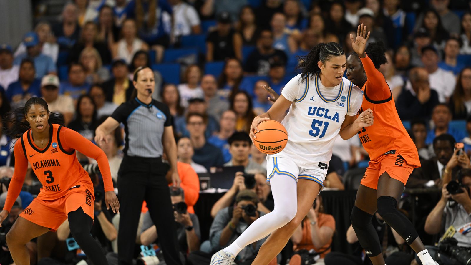 UCLA center Lauren Betts #51 makes a post-up move in the paint during an NCAA Women's Basketball game between Oklahoma State University and University of California Los Angeles on Monday, March 23, 2026 at Pauley Pavilion in Los Angeles Calif