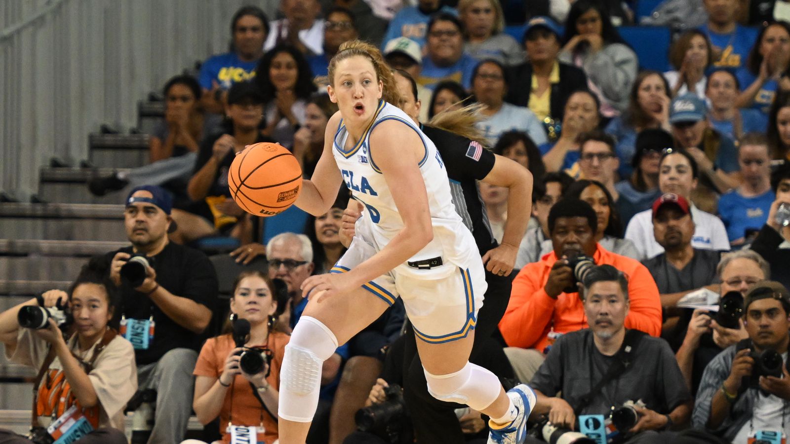 UCLA guard Gianna Kneepkens #8 runs the ball downcourt during a fast break during an NCAA Women's Basketball game between Oklahoma State University and University of California Los Angeles on Monday, March 23, 2026 at Pauley Pavilion in Los Angeles Calif