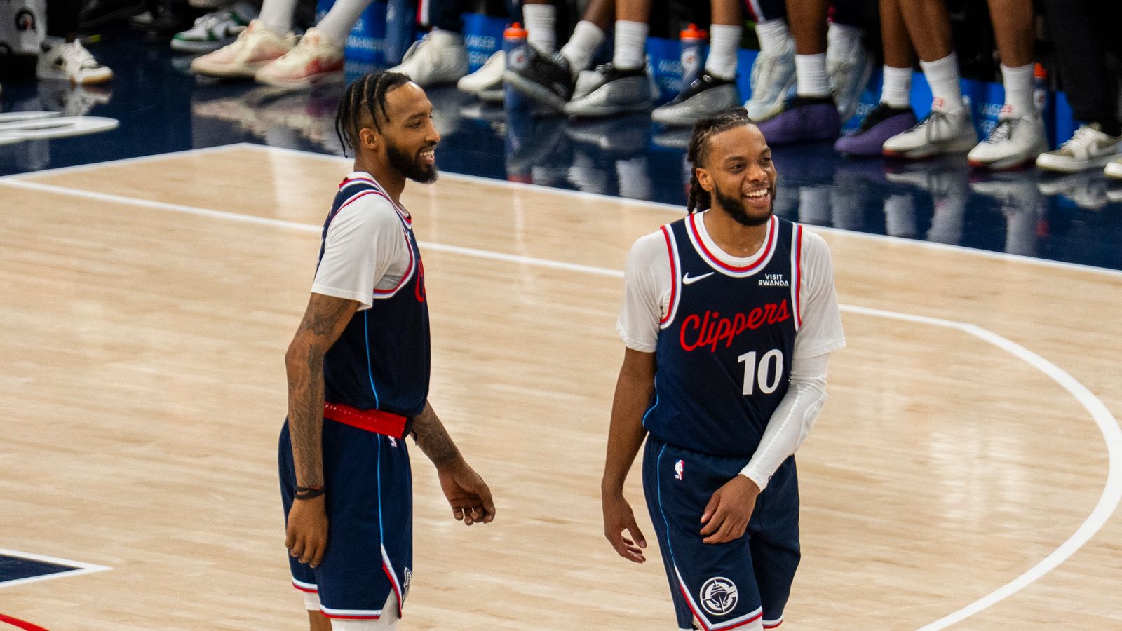 L.A. teammates share a quick strategy session during a dead ball