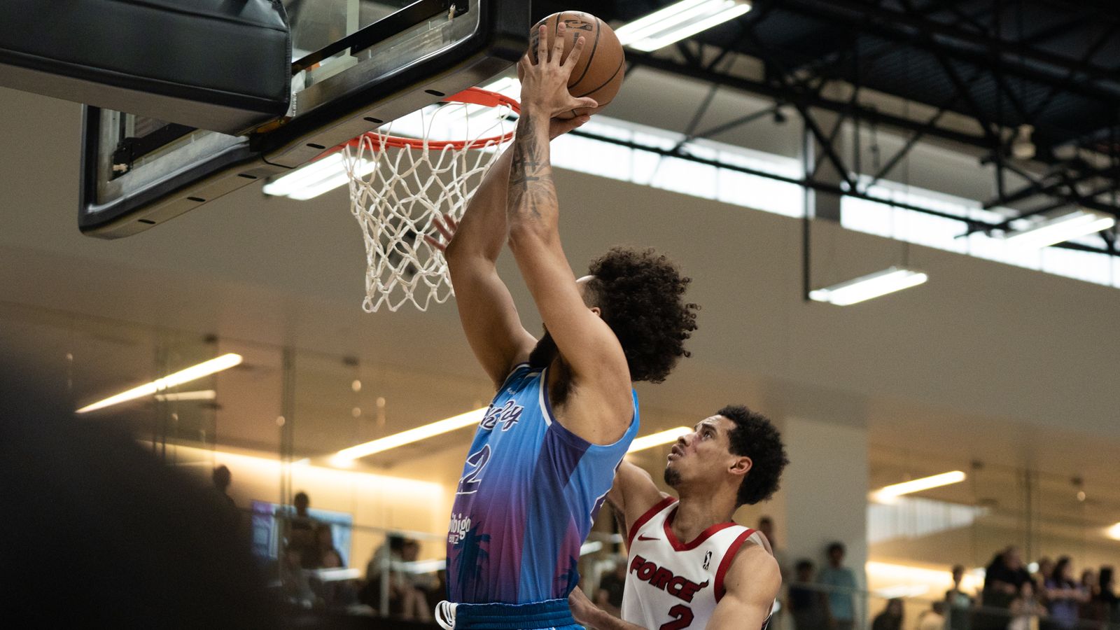 South Bay Lakers forward Anton Watson (22) grabs a rebound