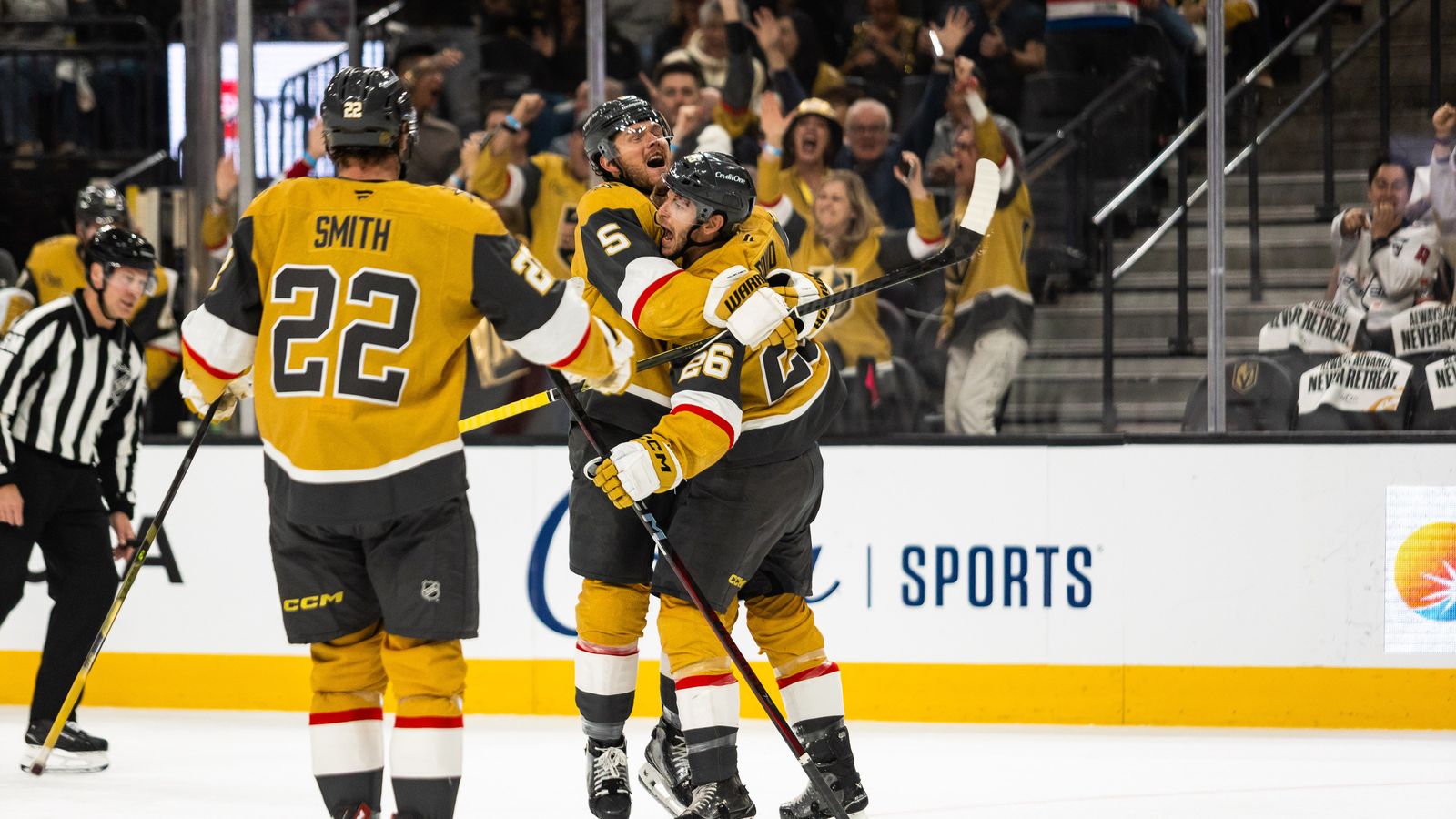 Vegas Golden Knights Jeremy Lauzon (5) embraces Nic Dowd (26)