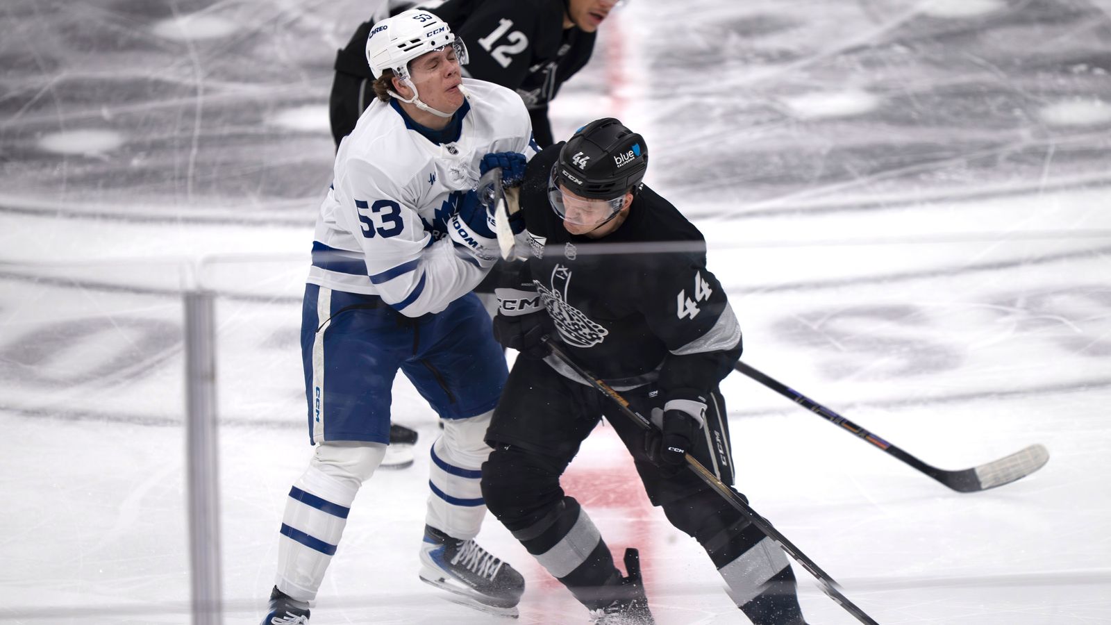 Kings defenseman Mikey Anderson (44) pushes a Maple Leaf