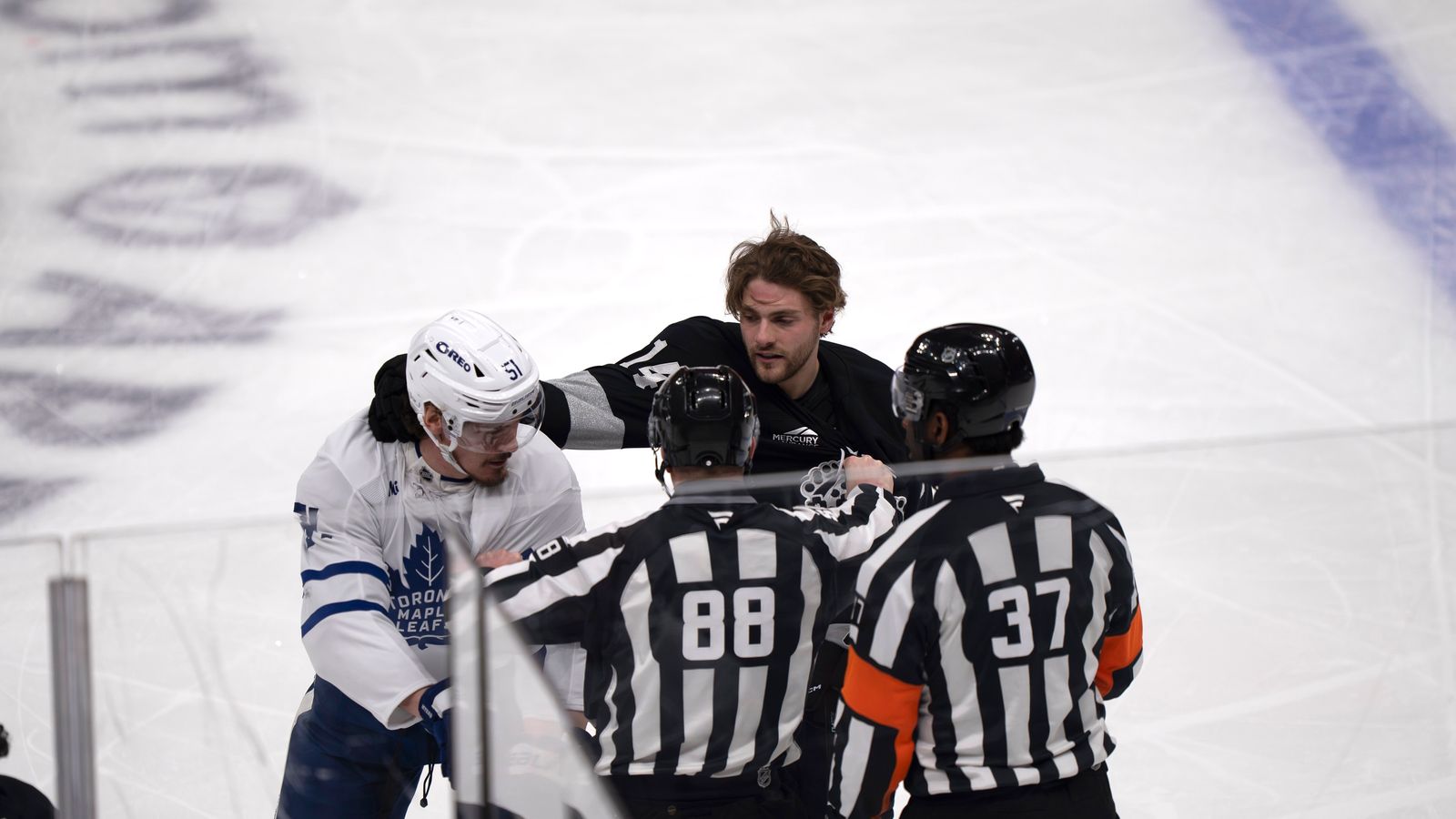 Kings Alex Laferriere (14) punches an opponent