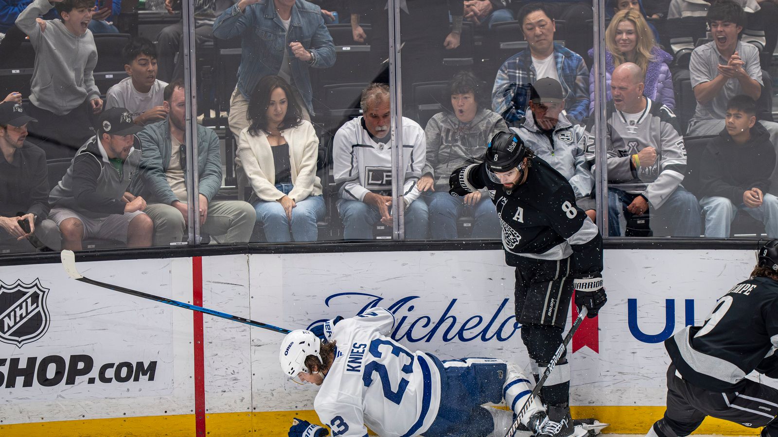 Kings Drew Doughty (8) standing over Matthew Knies