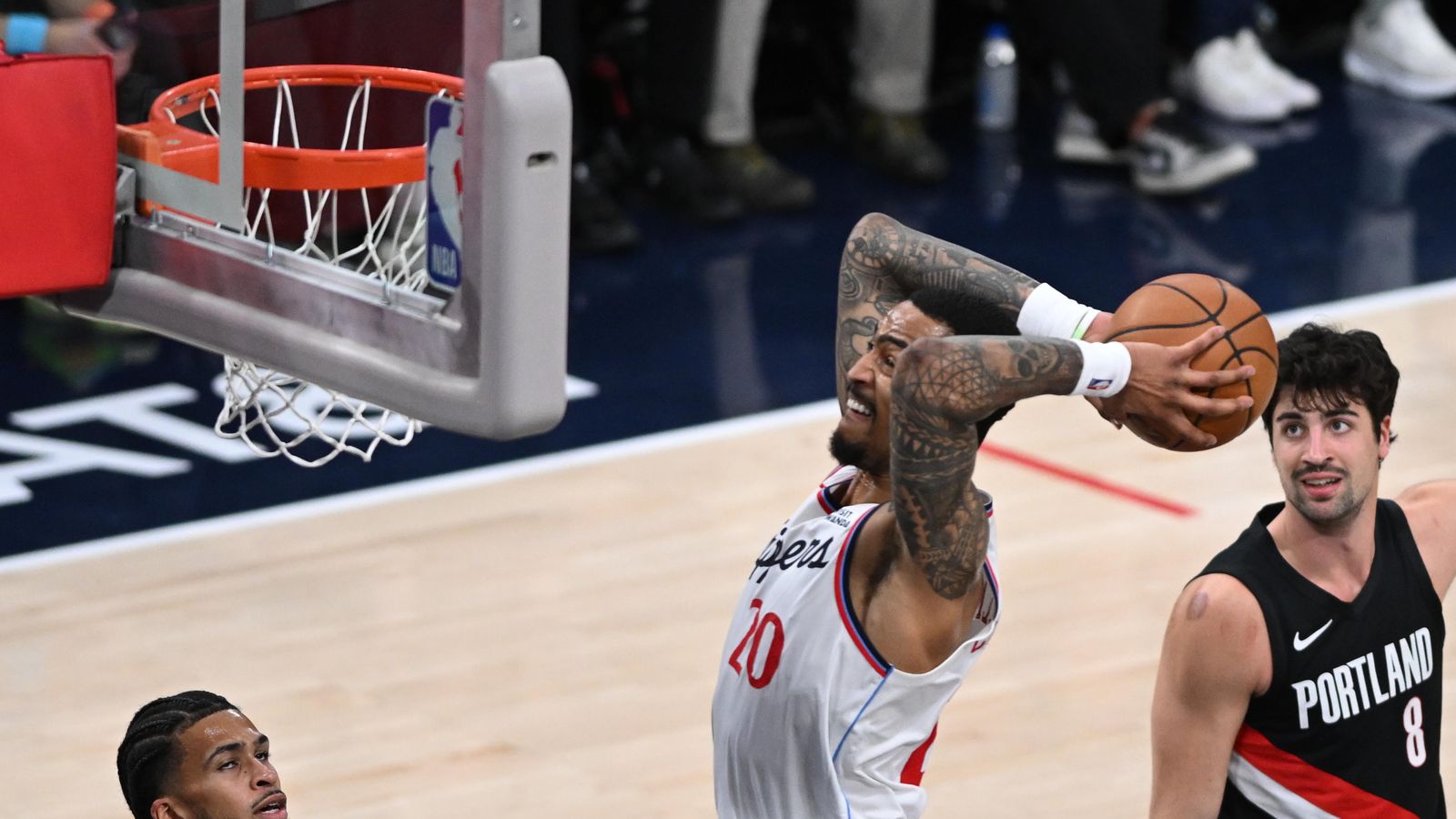 High-Flyer: John Collins elevates for a powerful finish at the cup