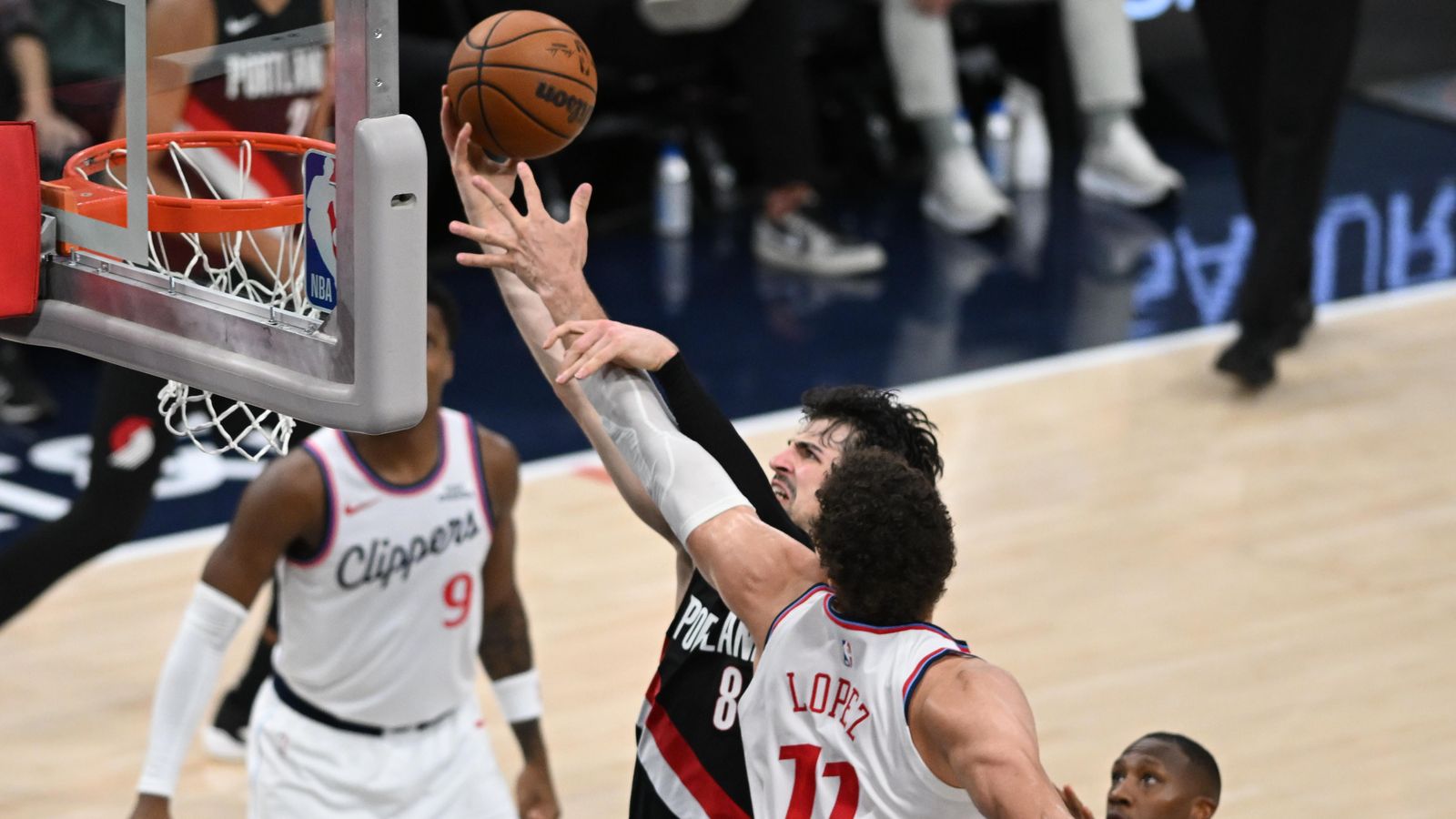 Finesse Finish: Deni Avdija lofts a layup over the Clippers' frontline