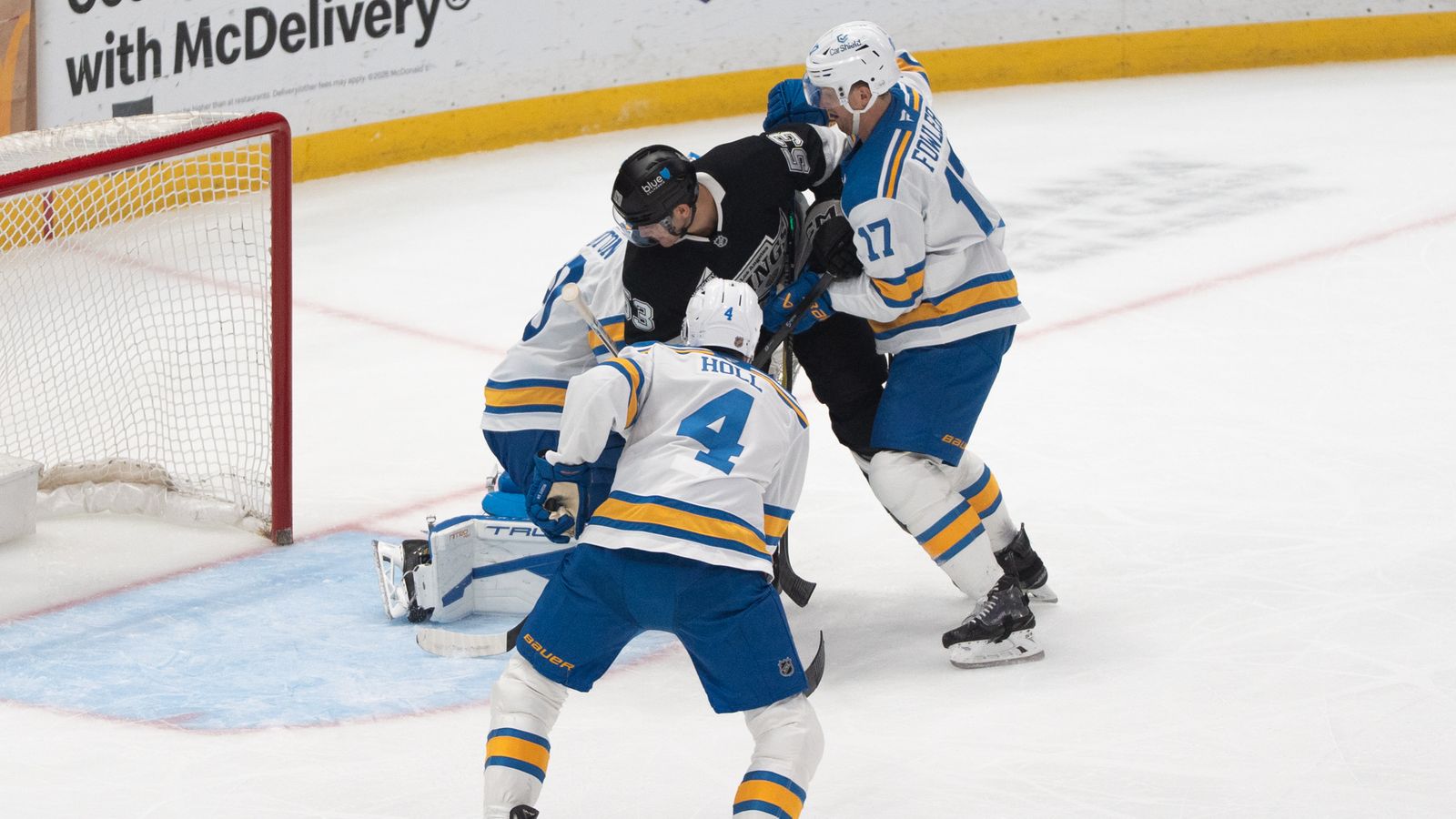 Against the Odds: Jared Wright takes on two Blues defenders on the rush