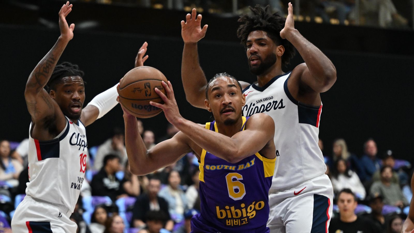 In the Paint: Kobe Bufkin navigates heavy traffic near the basket