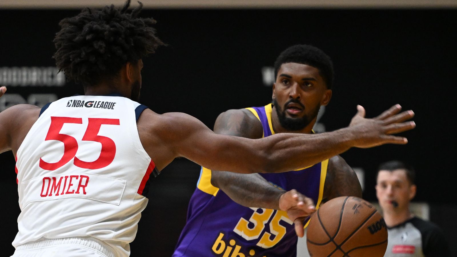 Finding the Open Man: Malik Williams dishes a pass from the post