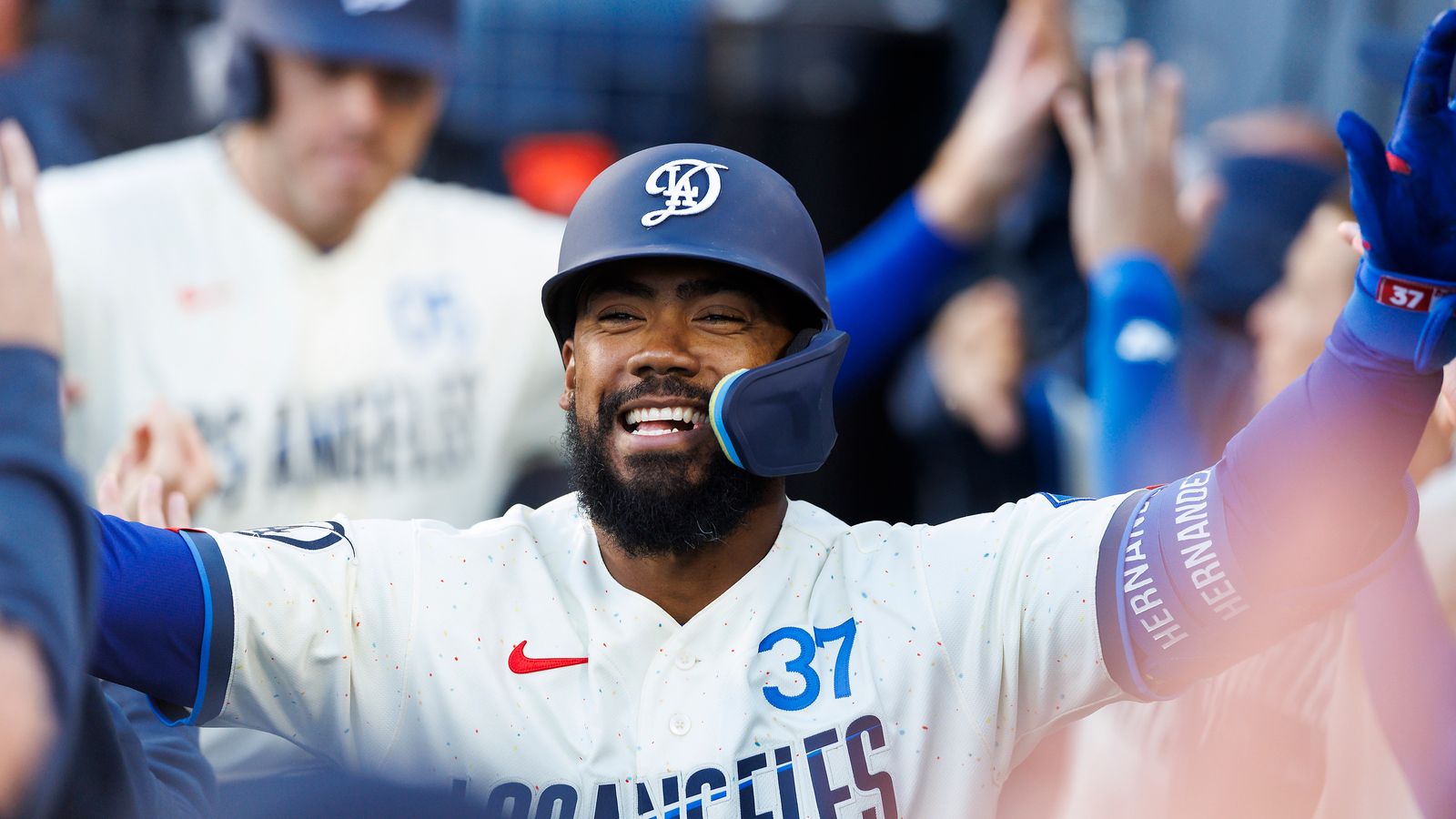 Dodgers Teoscar Hernandez #37 is congratulated in the dugout