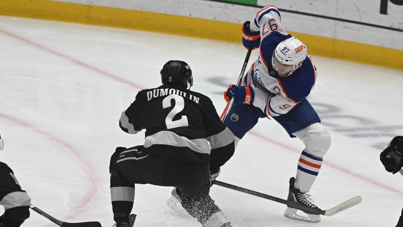 Kings Brian Dumoulin (2) Oilers Connor McDavid (97) battle for possession