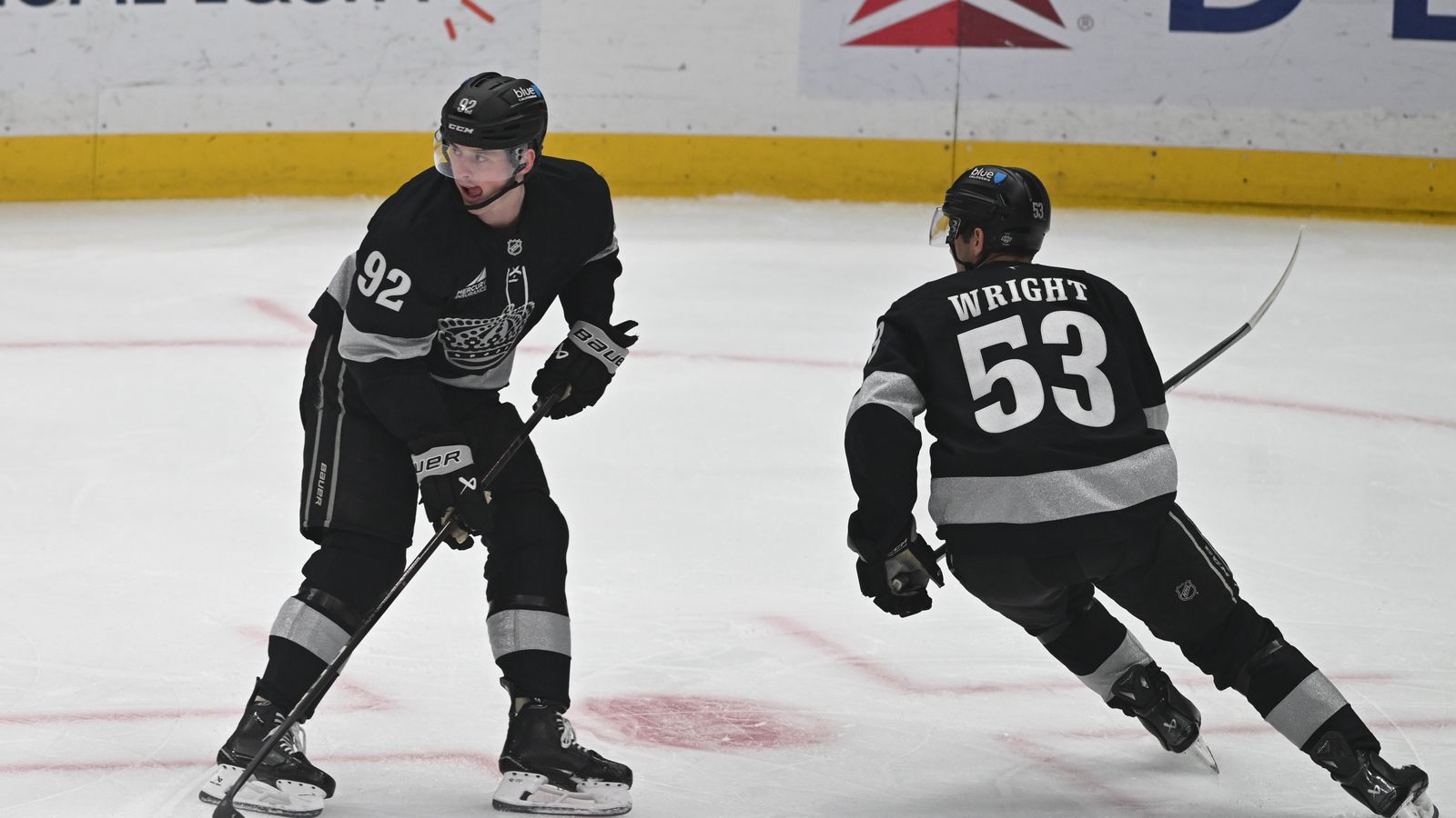 Kings Brandt Clarke (92) controls the puck