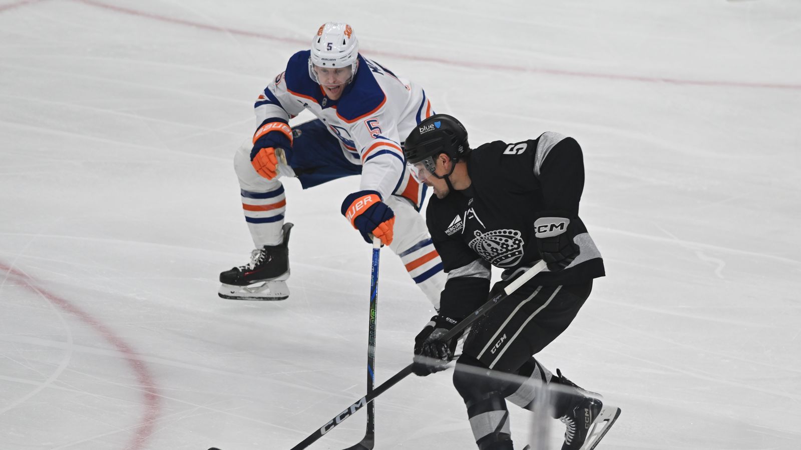 Kings Cody Ceci (5) controls the puck