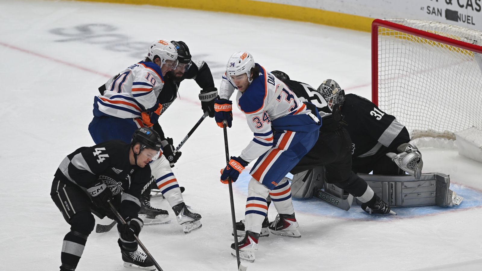 Kings Mikey Anderson (44) clears the puck