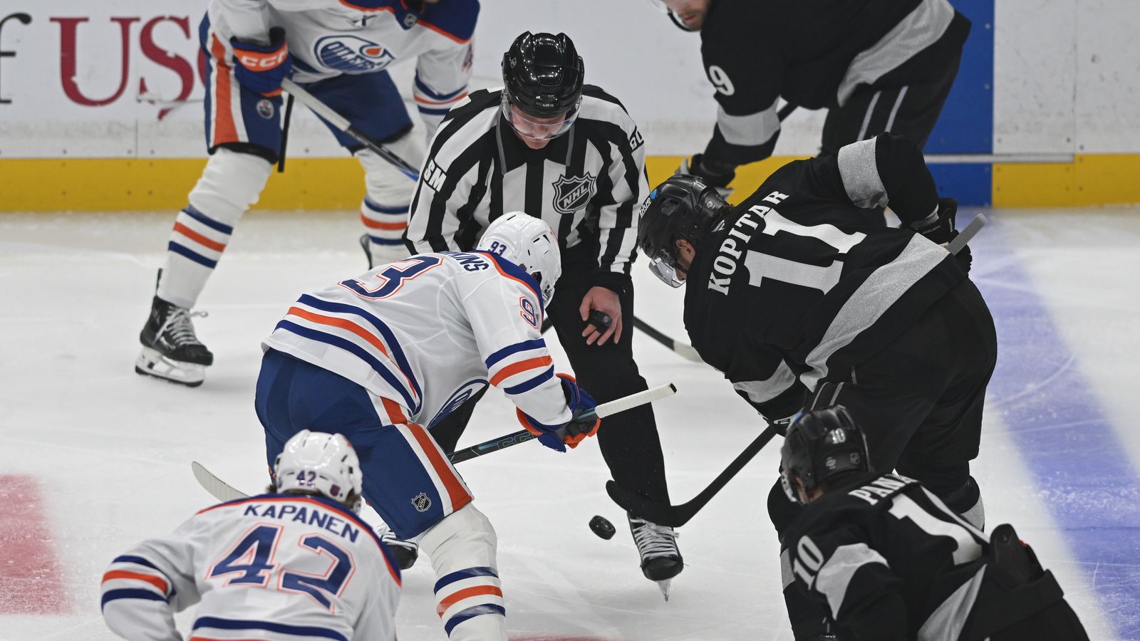 Kings Anze Kopitar (11) faces off with Oilers Ryan Nugent-Hopkins (93)