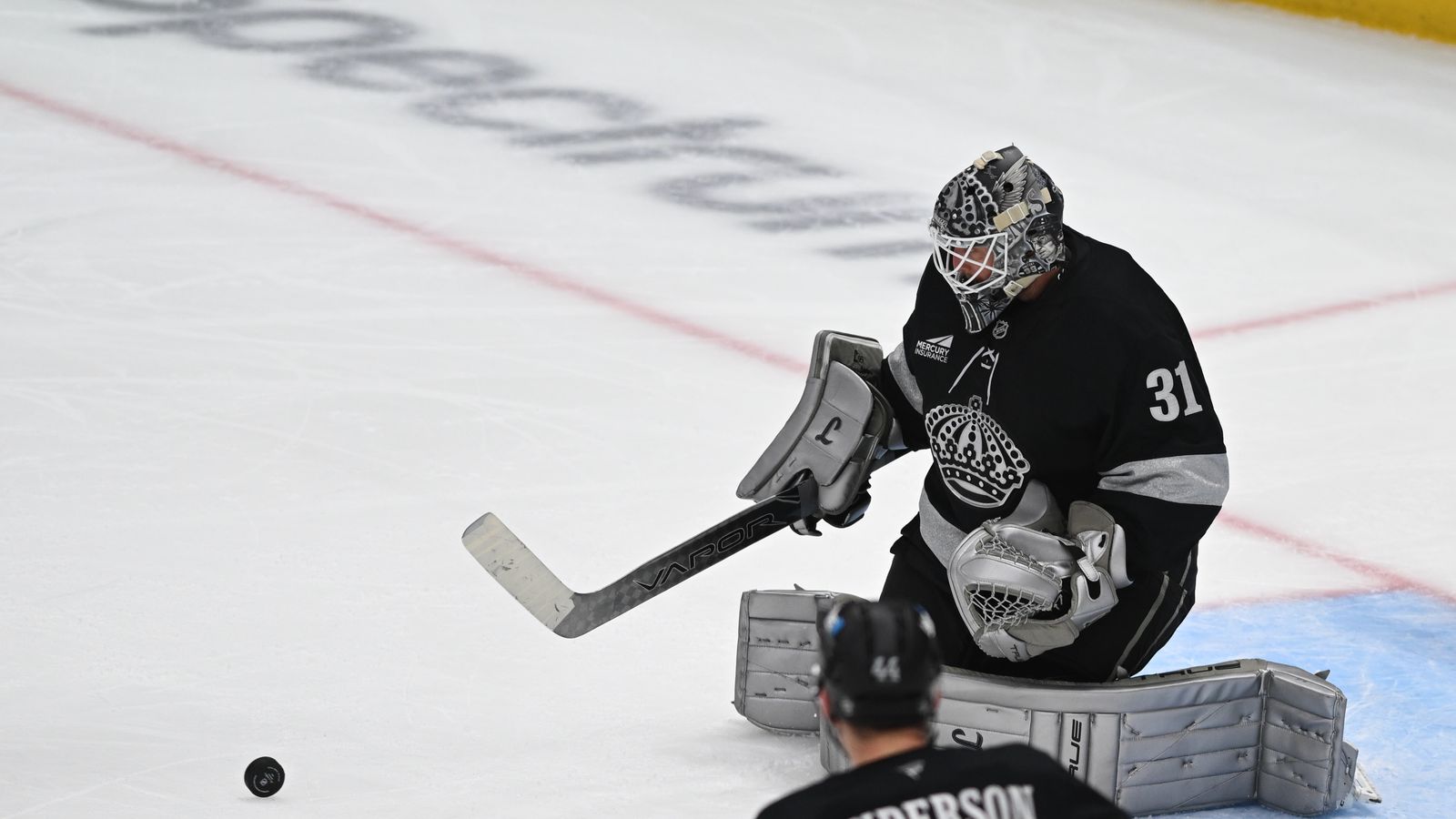 Kings Anton Forsberg (31) deflects the puck away