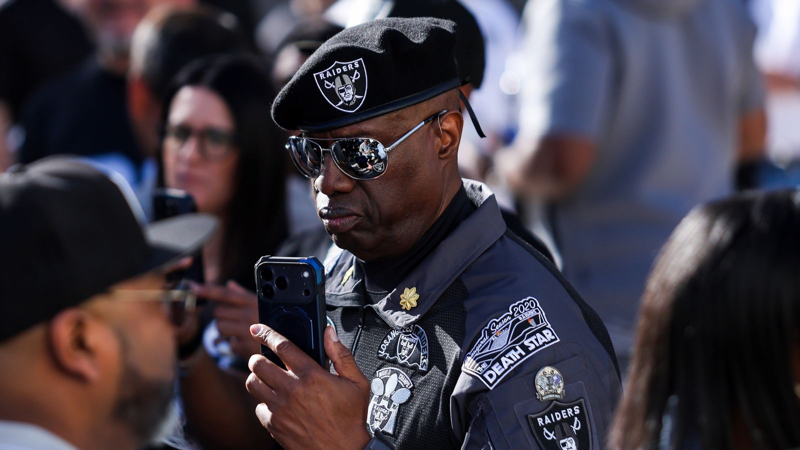 Raiders Fan Showcases Team Apparel and Commemorative Patches