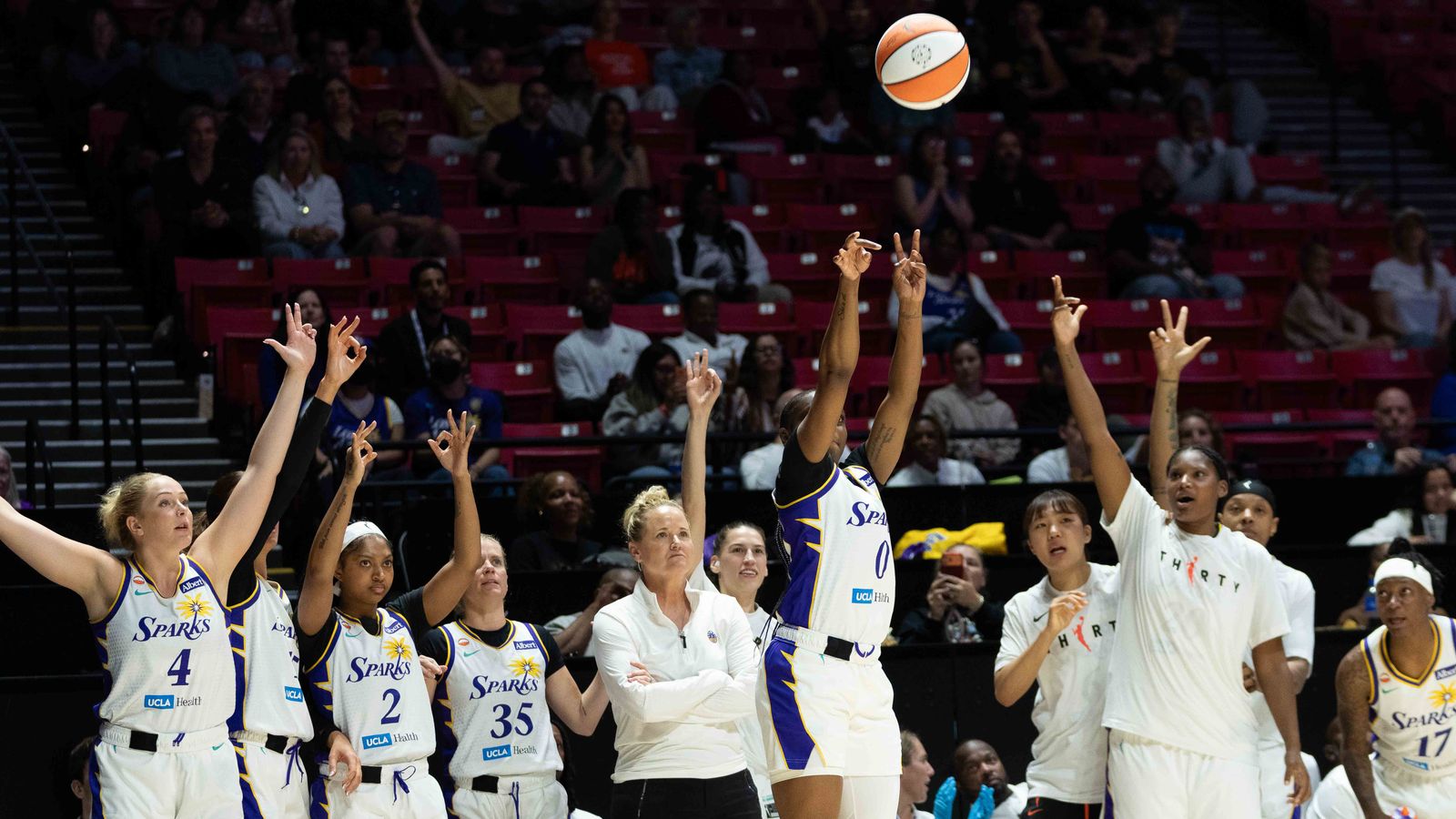 Sparks Ta’Niya Latson (0) shoots a three pointer
