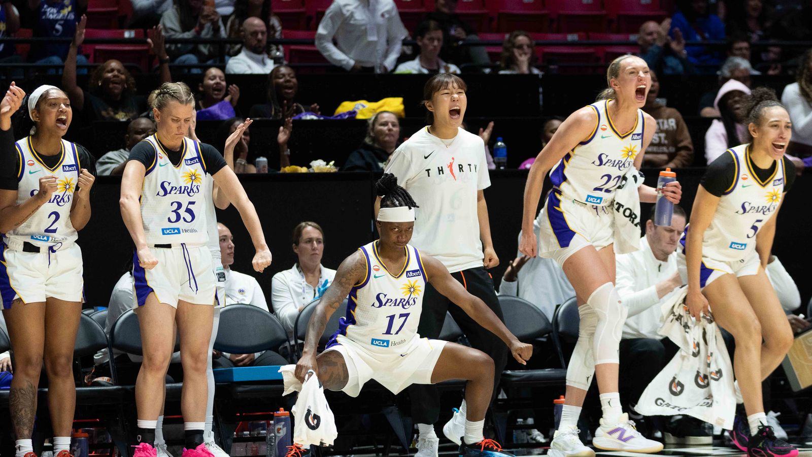Sparks bench celebrating a made three pointer