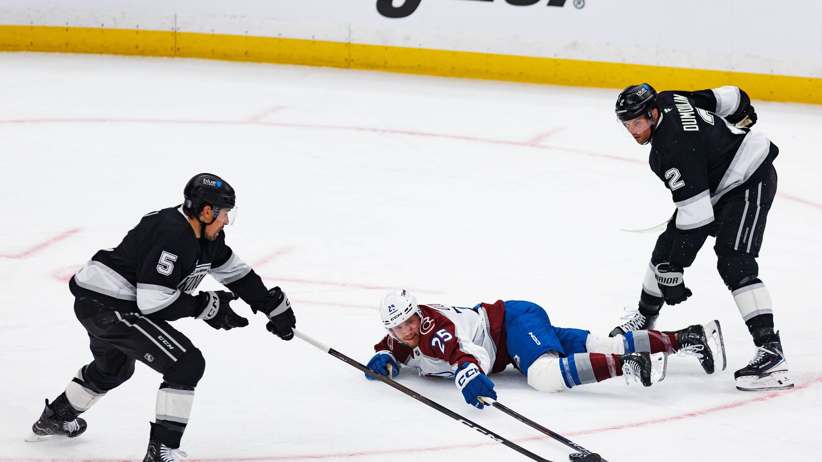 Logan O'Connor Battles for Puck Possession