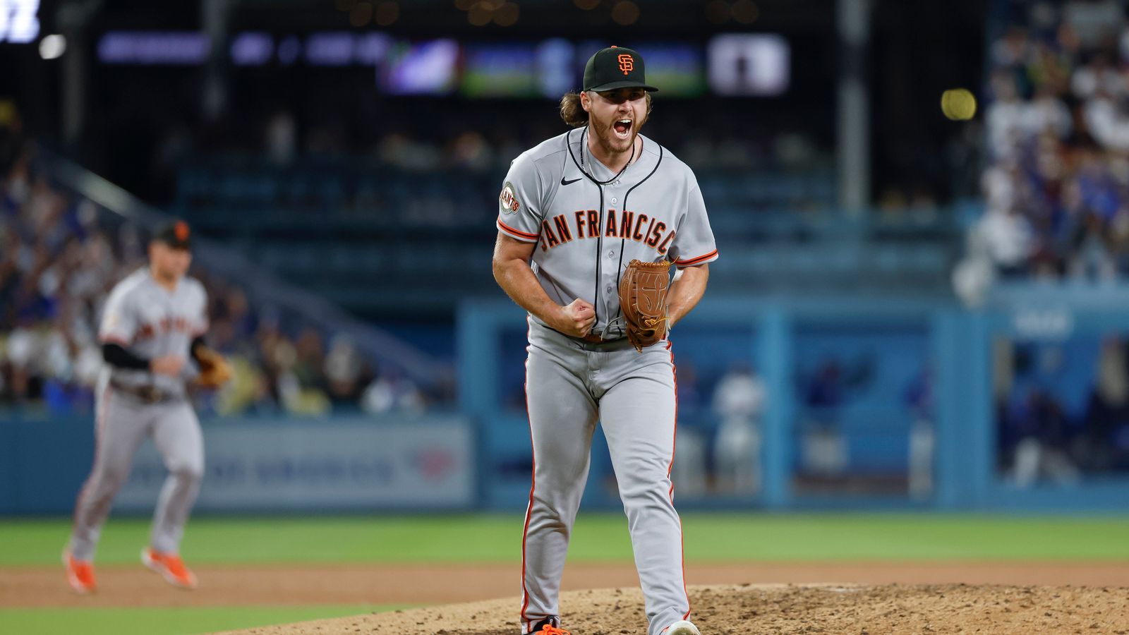 Landen Roupp celebrates a play against the Dodgers at Dodger Stadium.