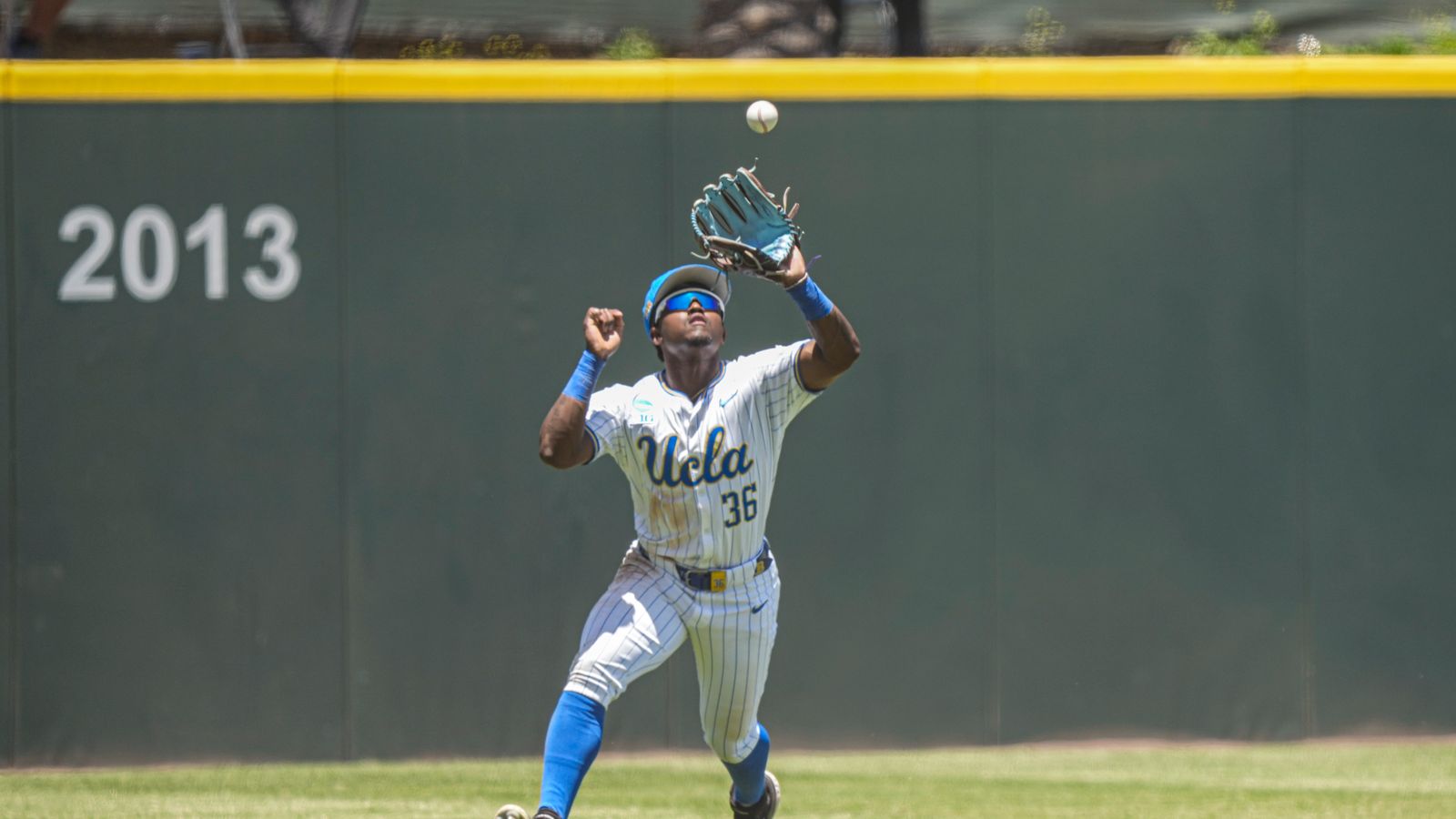 Dean West catches a pop fly in NCAA game